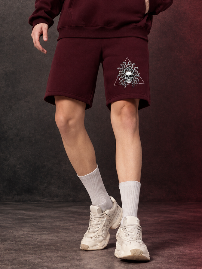 GORGON SKULL PRINTED FLEECE SHORTS WINE styled with white sneakers and socks for edgy streetwear comfort
