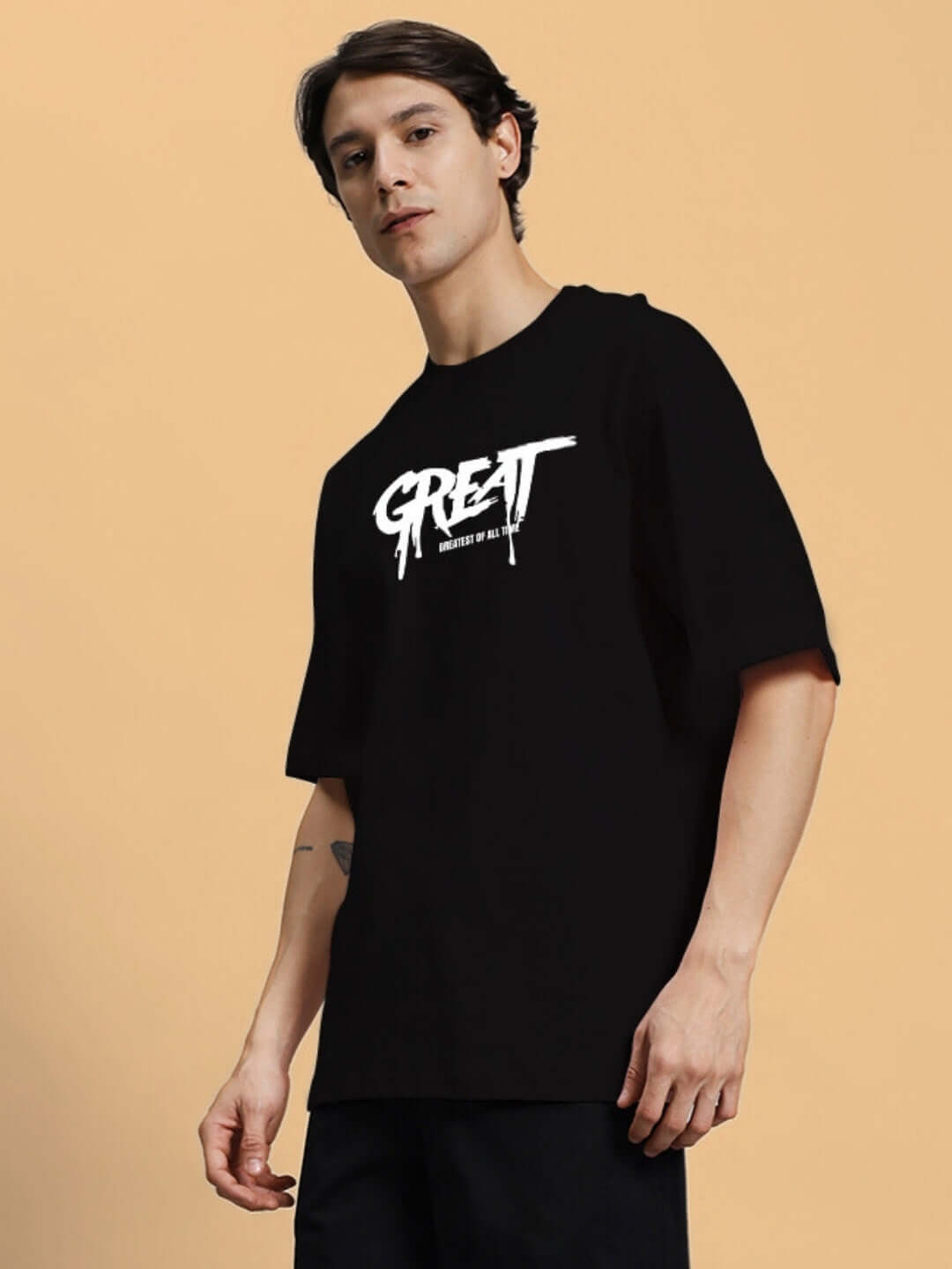 Man wearing GREAT PRINTED OVERSIZED T-SHIRT BLACK with premium heavy gauge fabric and bio-washed 100% cotton material