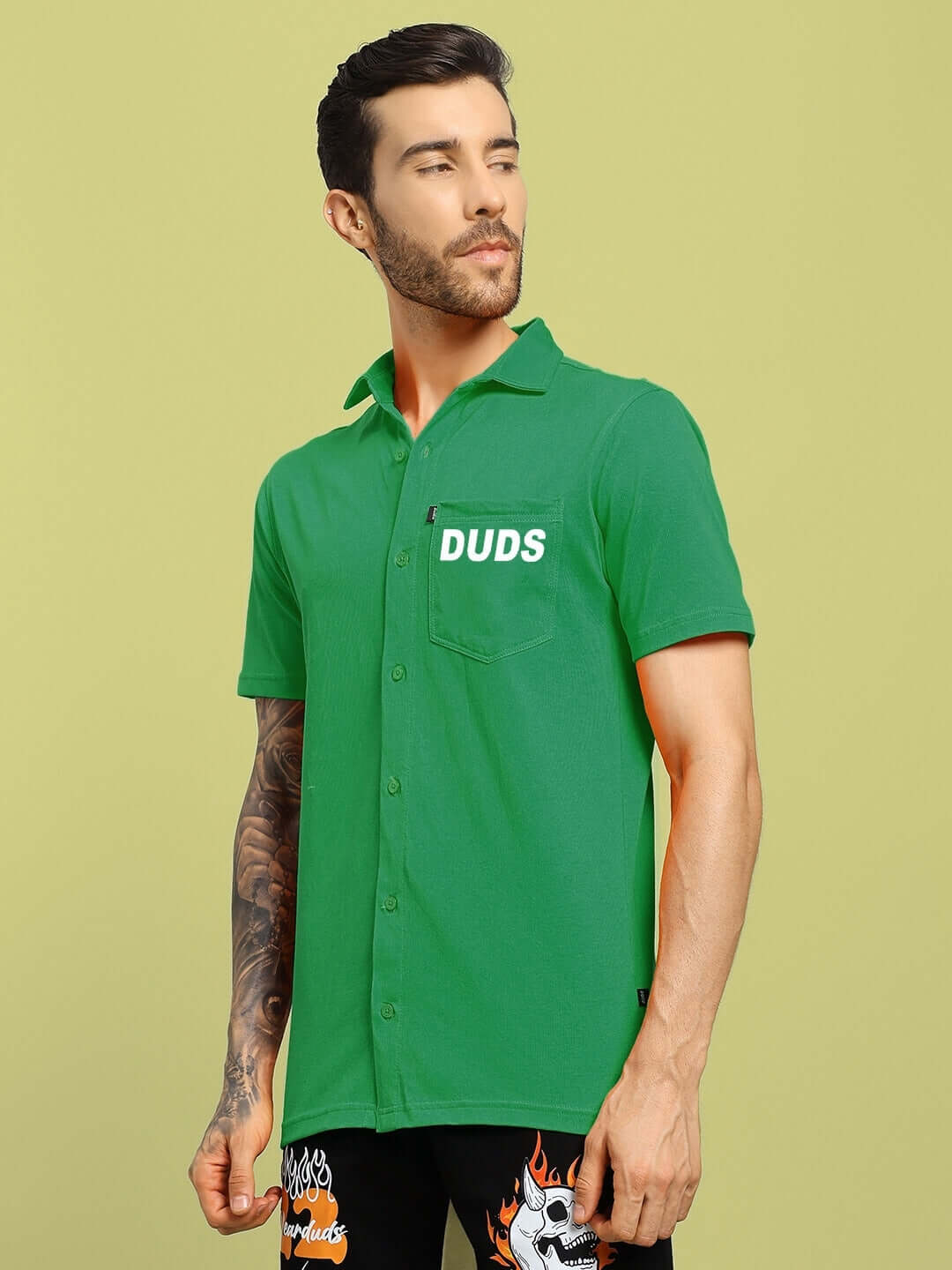 WINGS TEE Regular Fit Green Shirt with DUDS Logo, styled on a male model.