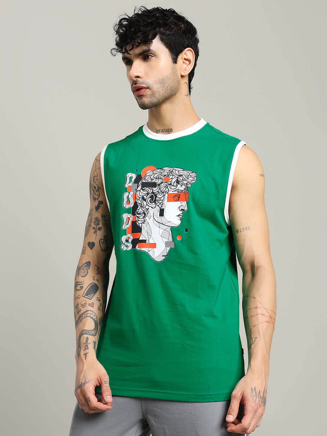 STREAM REGULAR FIT T-SHIRT GREEN with artistic graphic design worn by a tattooed model showcasing modern urban style.