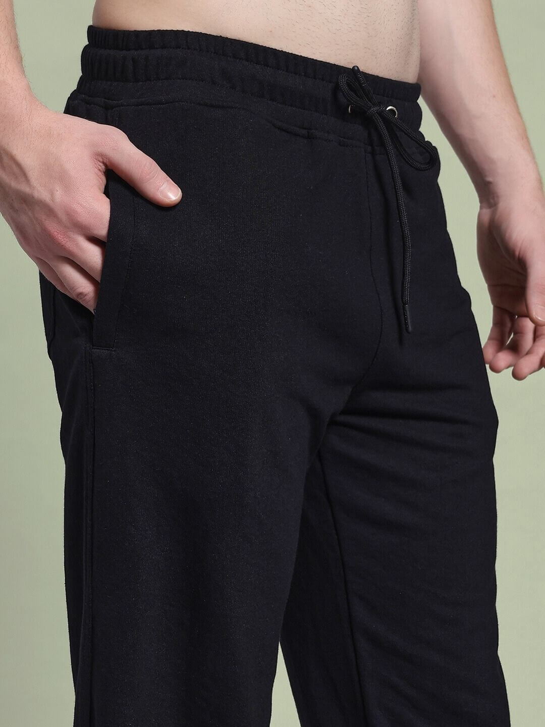 Model wearing JOSS WINS RELAXED-FIT JOGGER BLACK showing side pocket detail and drawstring waist in stylish fit.