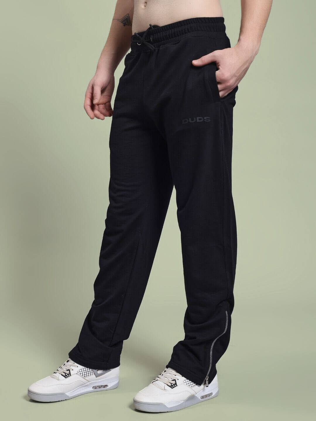 JOSS WINS RELAXED-FIT JOGGER BLACK worn by model with white sneakers, showcasing casual and comfortable style.