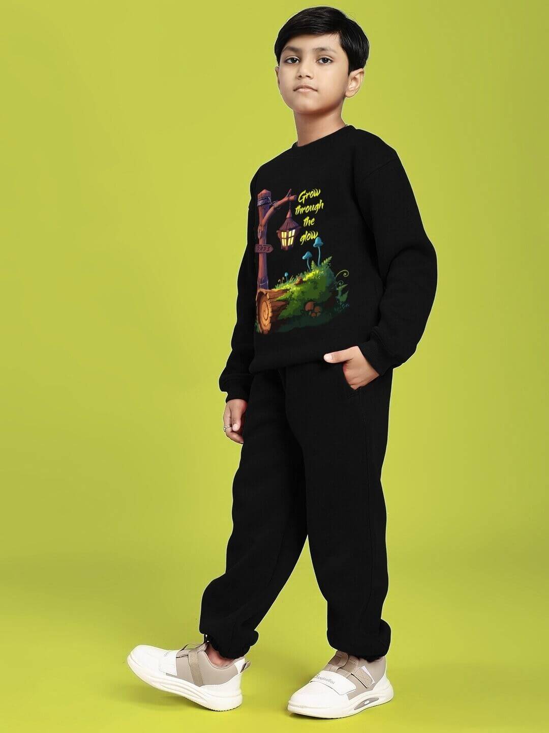 Child wearing GROW AND GLOW PRINT FLEECE CO-ORD FOR BOYS AND GIRLS BLACK.