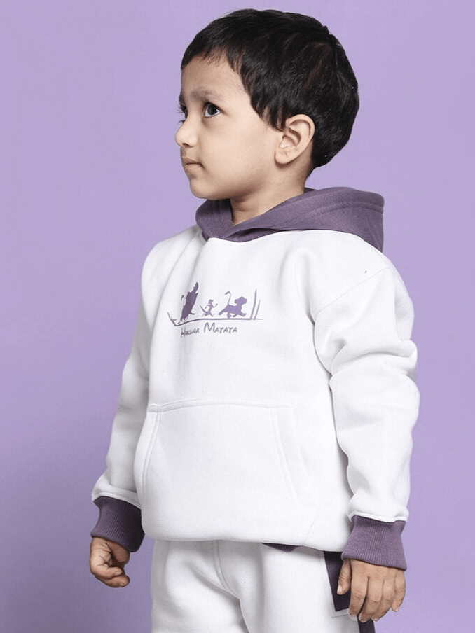 Child wearing Hakuna Matata oversized hoodie in white and violet, featuring playful design for boys and girls.