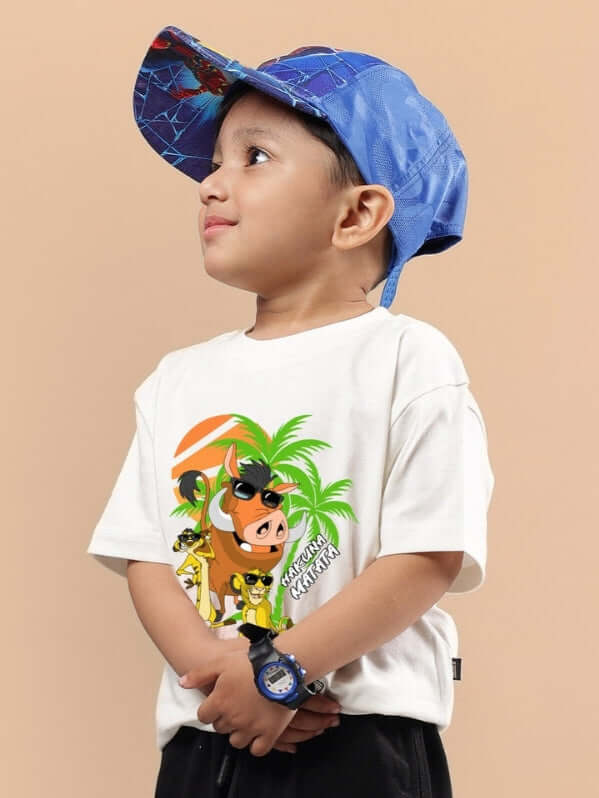 Child wearing HAKUNA MATATA OVERSIZED T-SHIRT FOR BOYS & GIRLS OFF WHITE, featuring cartoon design, paired with a blue cap.
