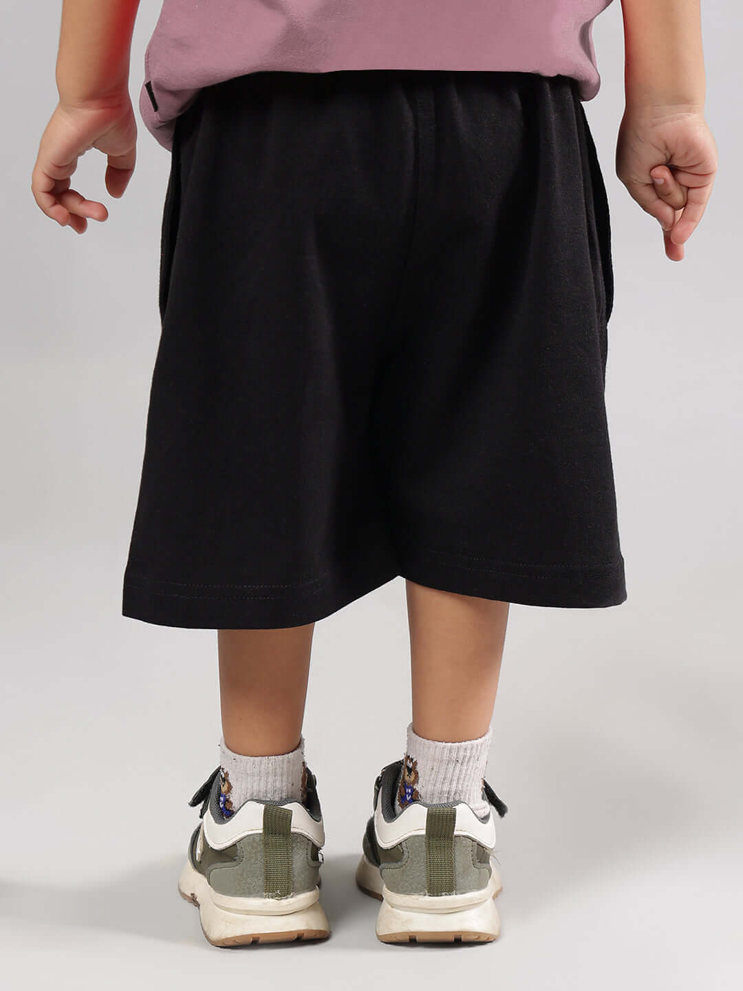 Child wearing HAPPY DUDS CO-ORD FOR BOYS GIRLS CHINESE VOILET-BLACK back view showcasing comfortable shorts.