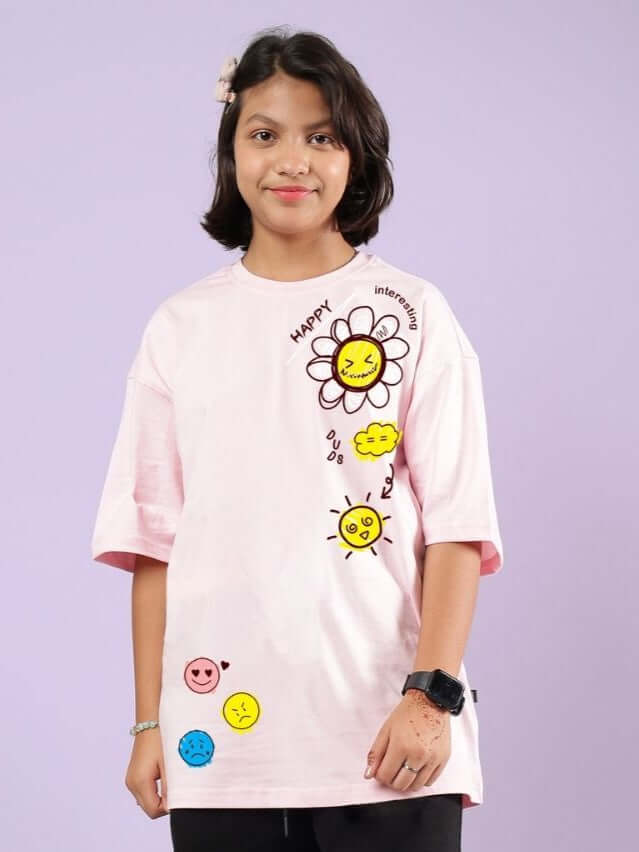 Child wearing HAPPY INTERESTING OVERSIZED T-SHIRT FOR BOYS AND GIRLS PINK with cheerful smiley design