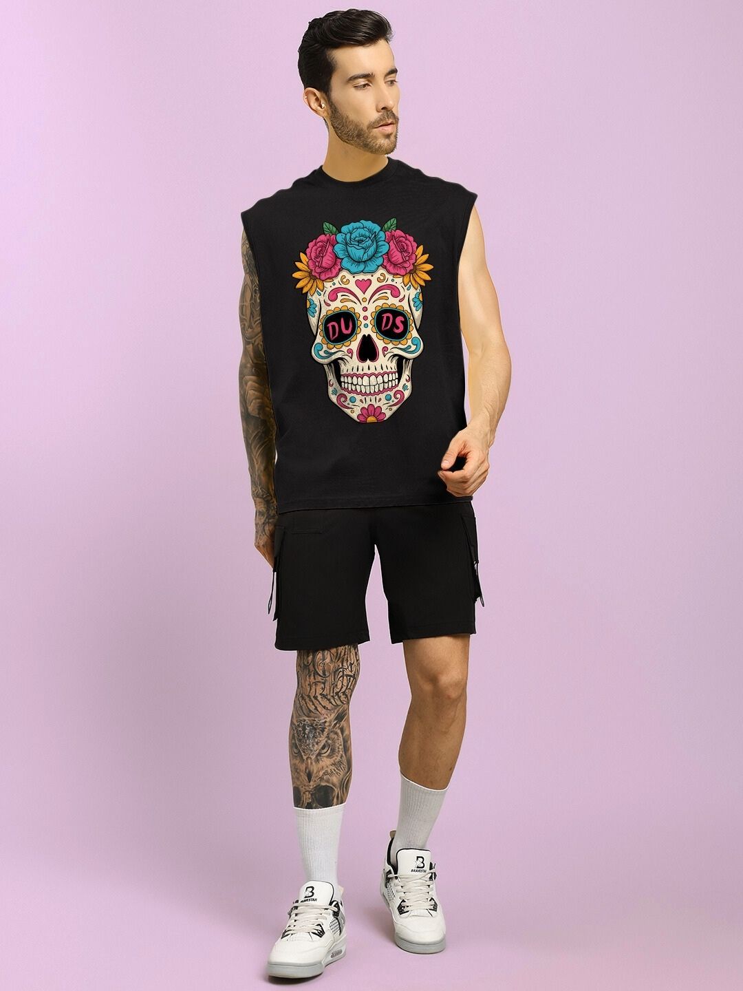 Man wearing HAPPY SKULL PRINTED GYM T-SHIRT BLACK with colorful skull design, perfect for workout and casual wear.