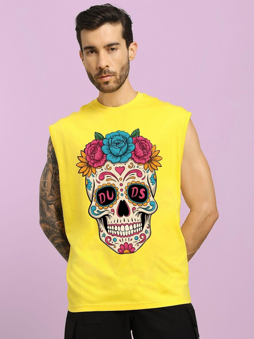 Man wearing HAPPY SKULL PRINTED GYM T-SHIRT YELLOW with colorful skull design on chest.