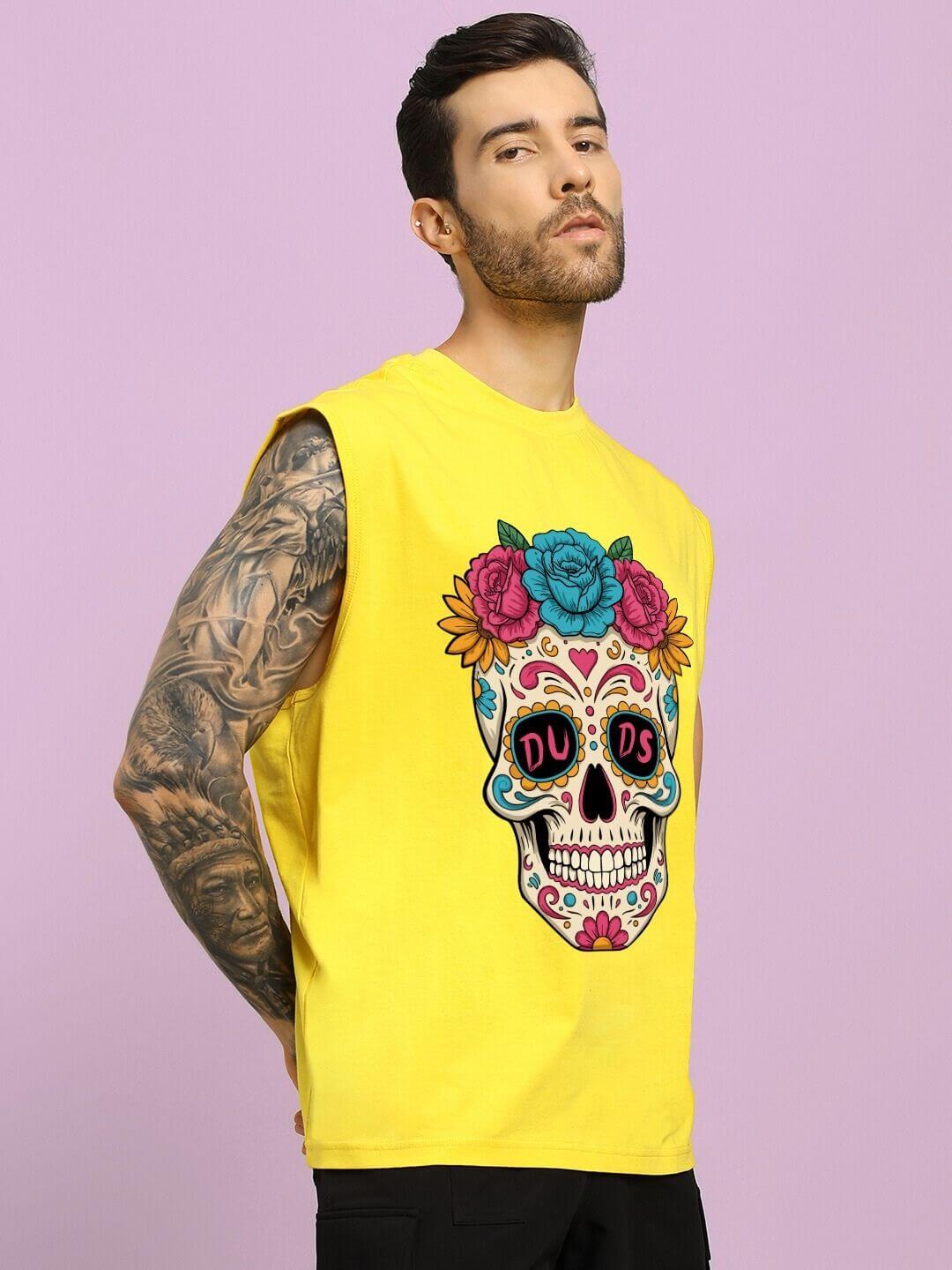 Man wearing HAPPY SKULL PRINTED GYM T-SHIRT YELLOW showcasing bold design and vibrant color against a purple background.