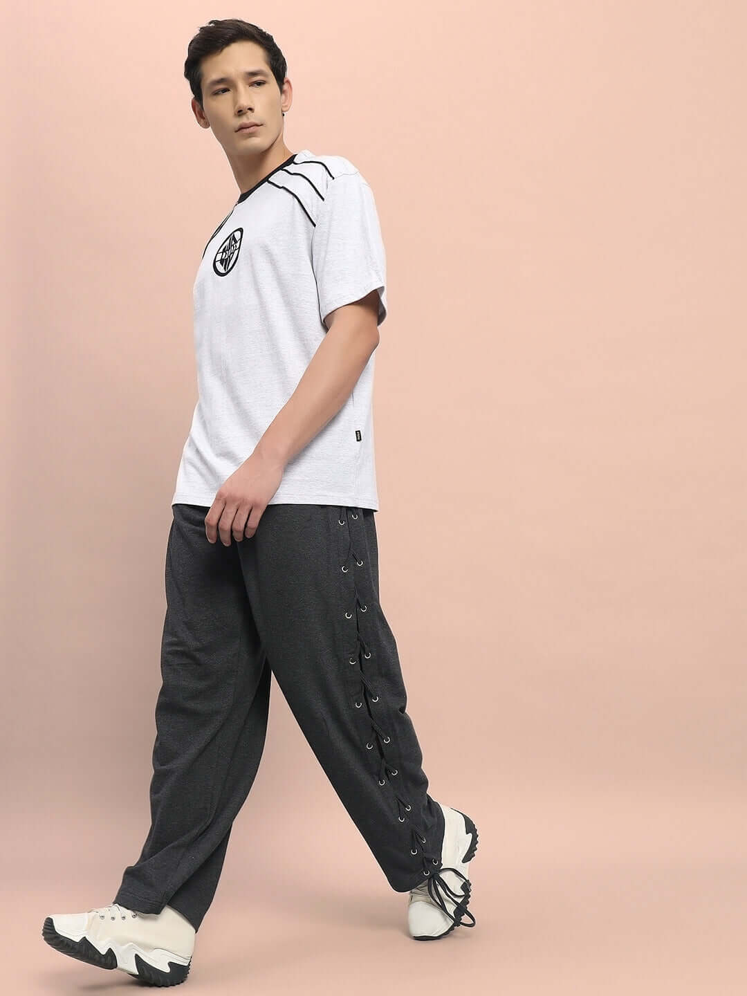 Alt Tag: Model wearing grey Hazel relaxed fit joggers from DUDS, highlighting the comfortable design and custom fit option.
