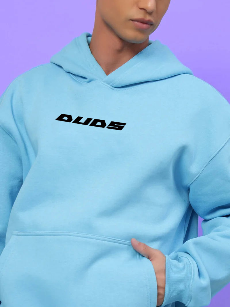 HEARTBREAK OVERSIZED FLEECE HOODIE LIGHT BLUE on person against purple background