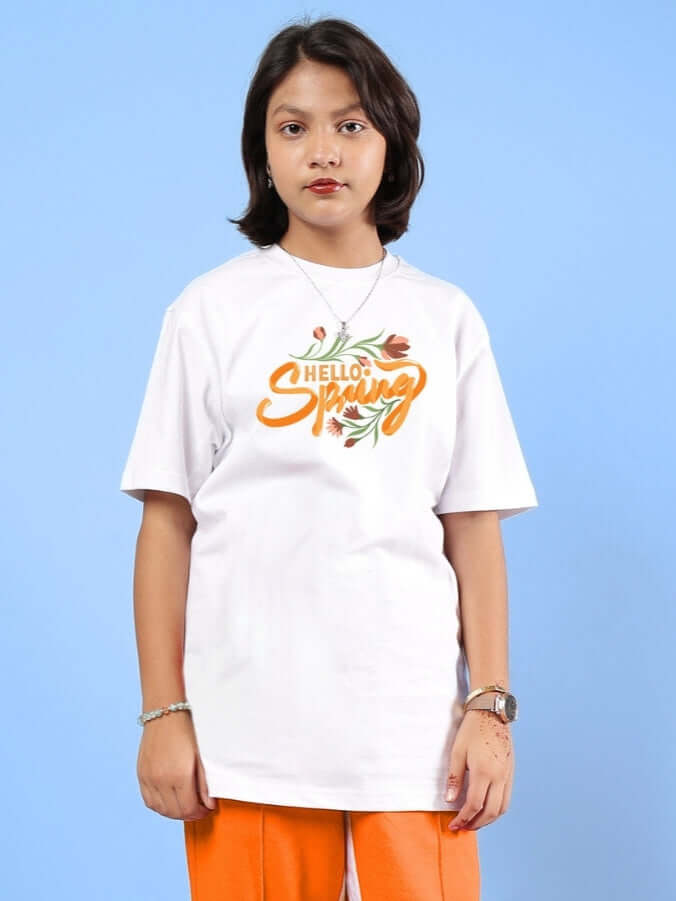 Child wearing HELLO SPRING T-SHIRT FOR BOYS & GIRLS WHITE with floral design, perfect for casual style. Made to order with custom fit option.