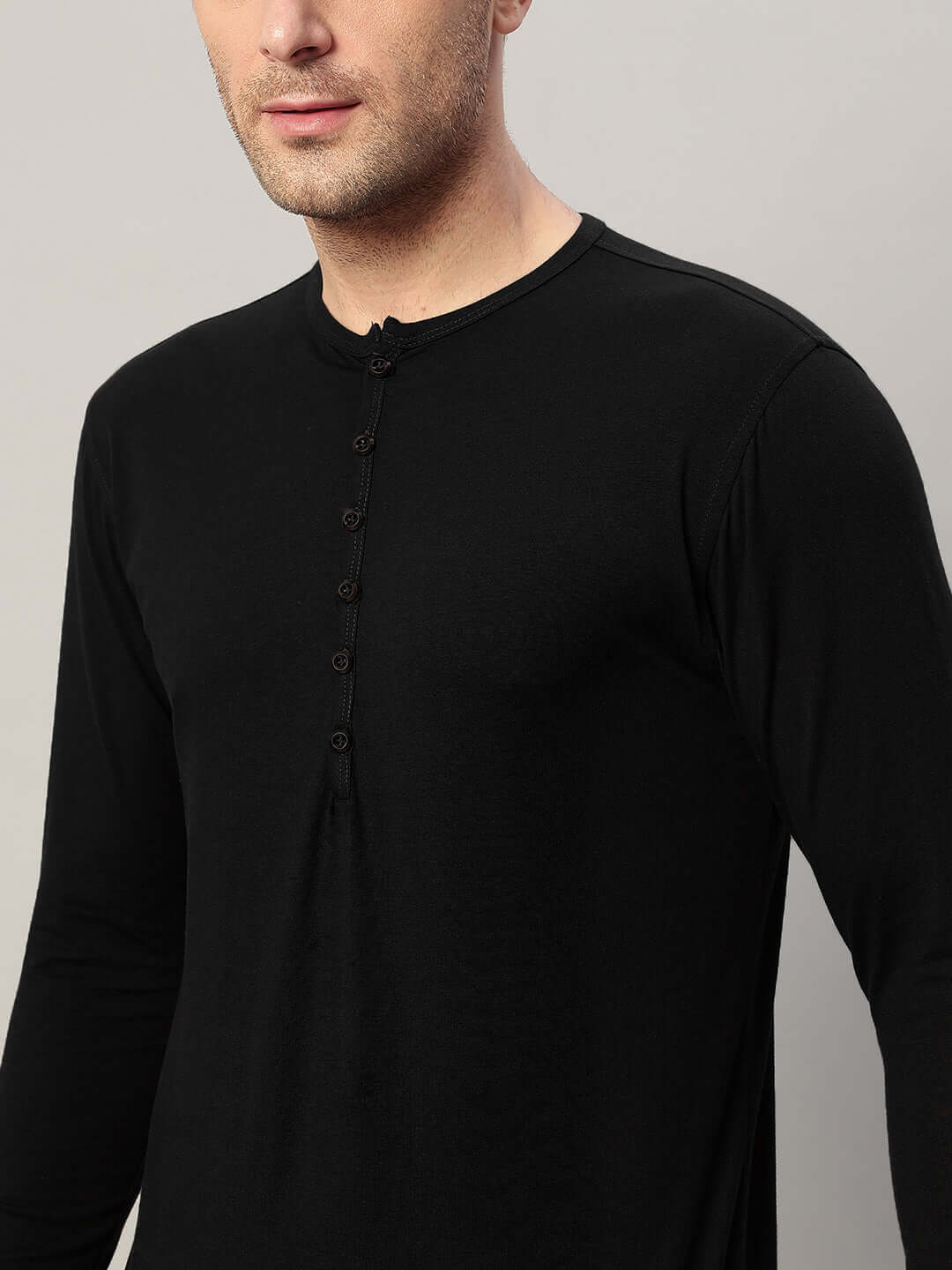 HENNY slim fit black sweatshirt, 100% cotton, featuring long sleeves and button detailing, worn by a model.