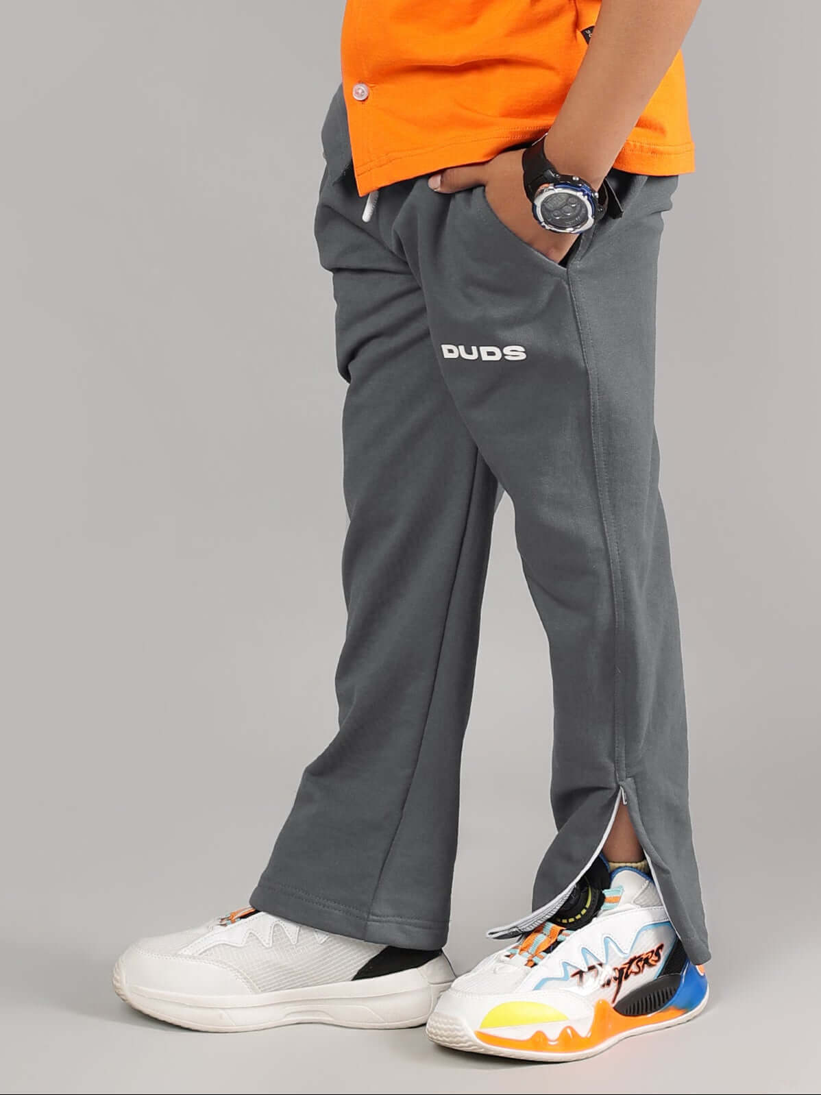 Boy wearing HERSHEY JOGGER FOR BOYS & GIRLS GREY, featuring comfortable fit and style by DUDS, ideal for children.