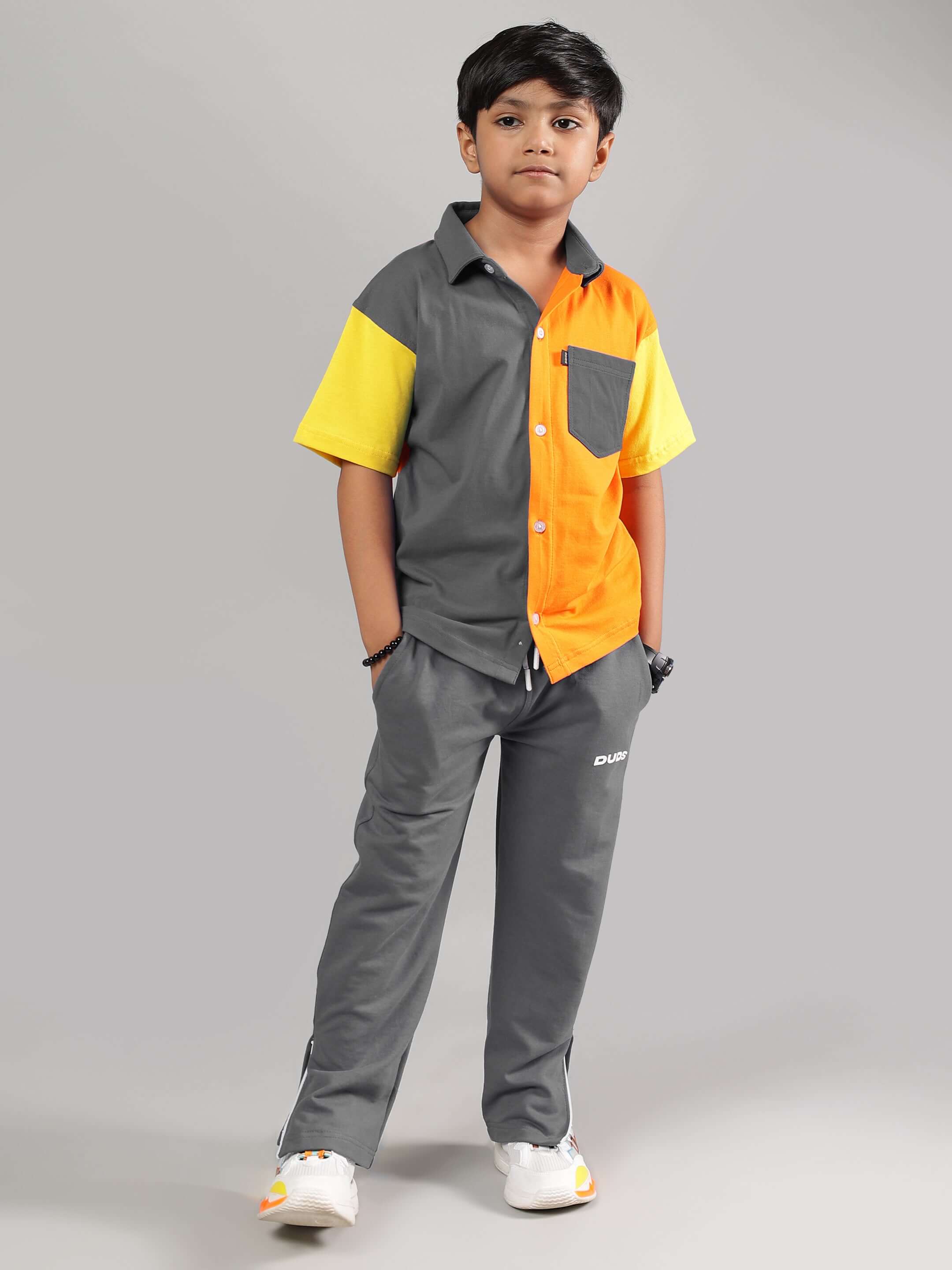 Boy wearing HERSHEY JOGGER FOR BOYS & GIRLS GREY with colorful shirt, showcasing casual style. Custom fit available for tailored comfort.