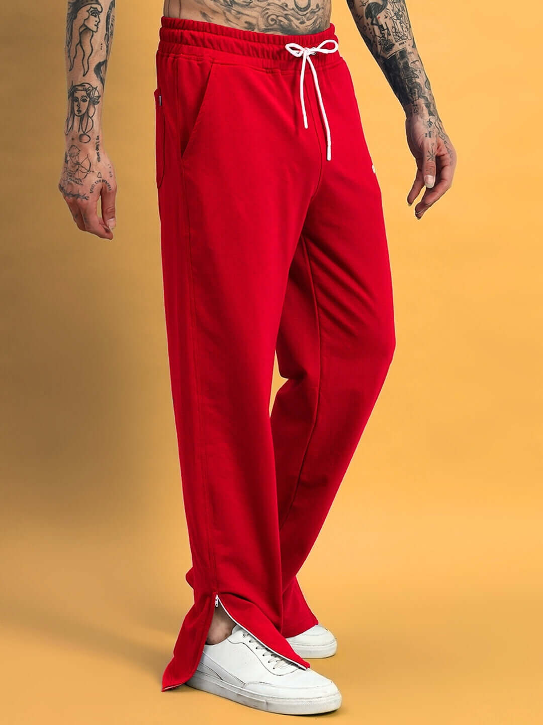 Red Hershey side slit joggers by DUDS, featuring customizable fit and made-to-order by skilled tailors for premium comfort.