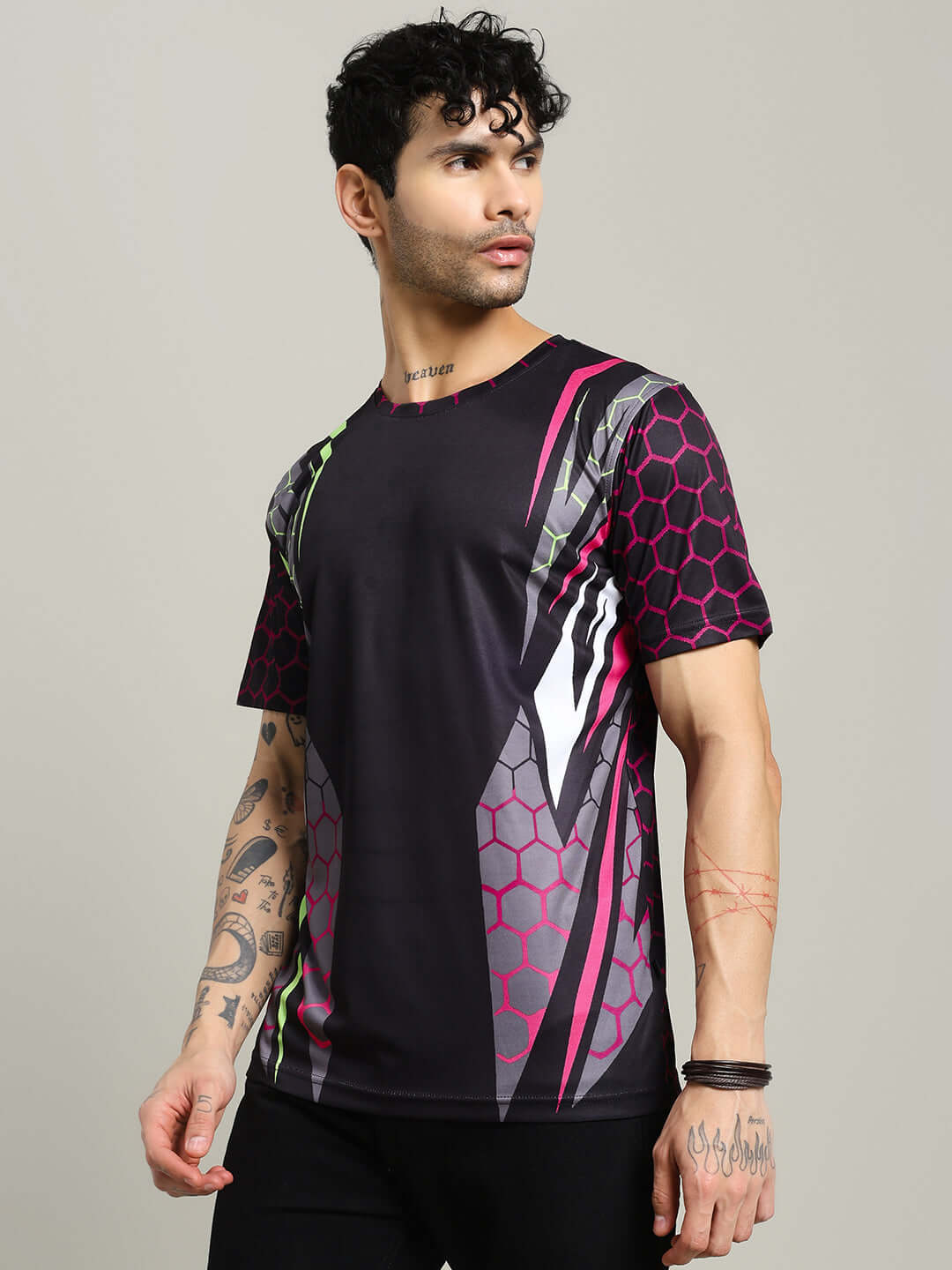 Model wearing HEXAGON PRINTED REGULAR FIT T-SHIRT BLACK with modern hexagon design, perfect for stylish casual wear.