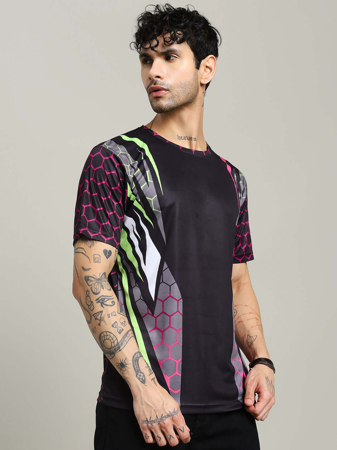 Man wearing HEXAGON PRINTED REGULAR FIT T-SHIRT BLACK with modern hexagon design, showcasing comfort and style.