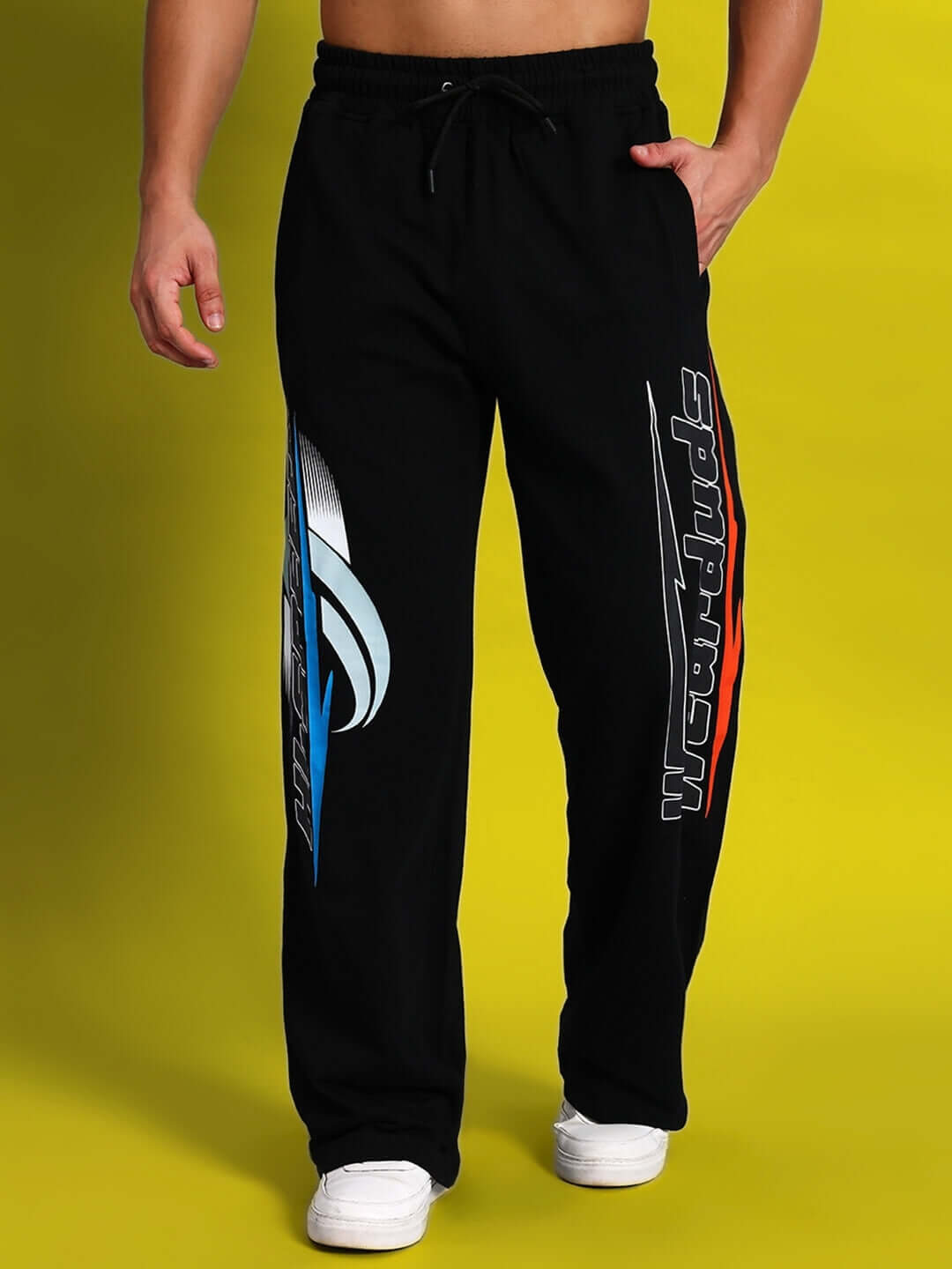 Man wearing black HI-SPEED RELAXED FIT JOGGER with sporty design on legs, ideal for casual wear and tailored comfort.