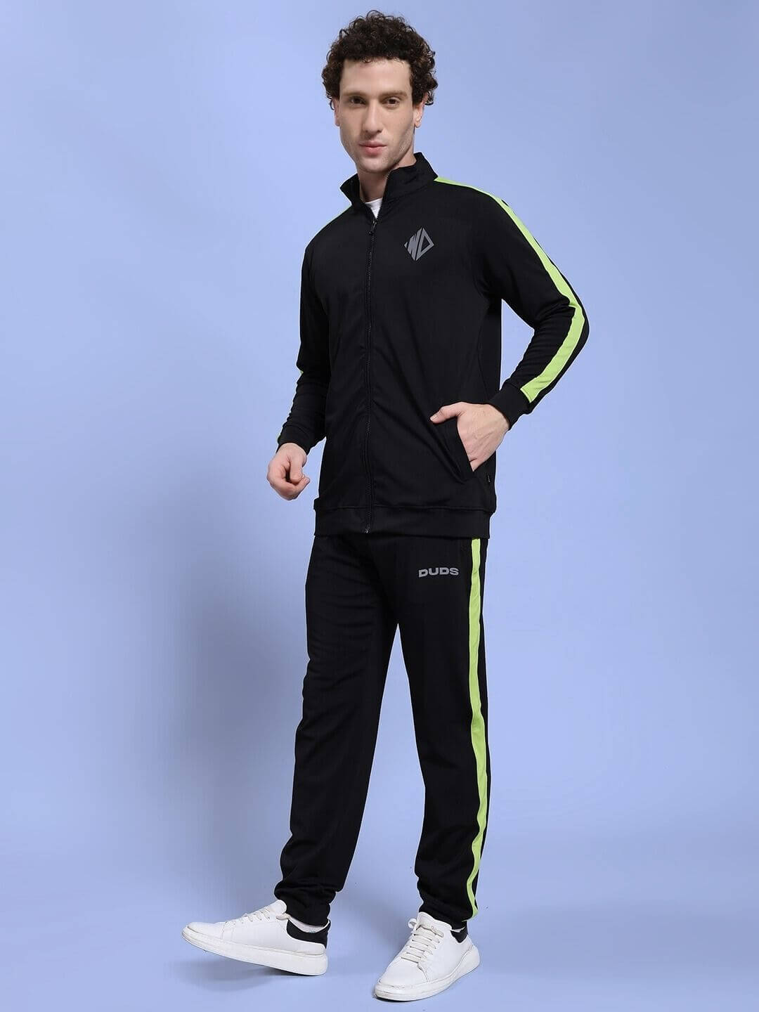 Model wearing HIGH PERFORMANCE CO-ORD SET BLACK with zip-up hoodie and tapered joggers, showcasing athleisure fashion.