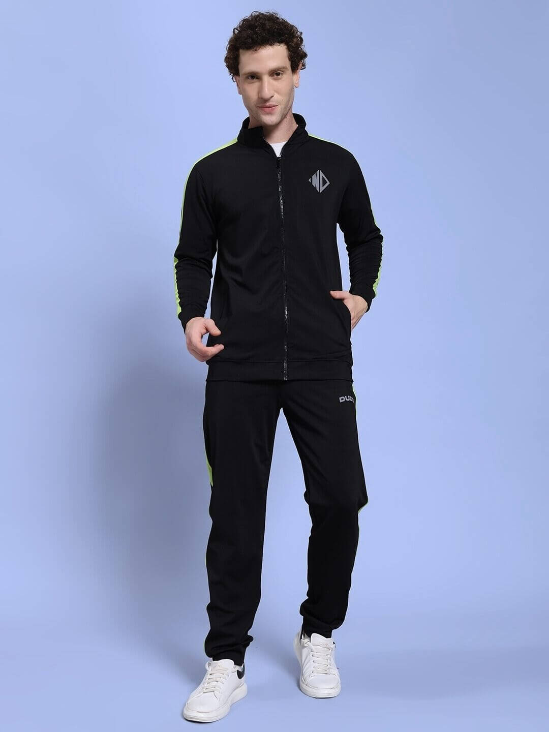 Man wearing HIGH PERFORMANCE CO-ORD SET BLACK with zip-up hoodie and tapered joggers, ideal for workouts and casual outings.