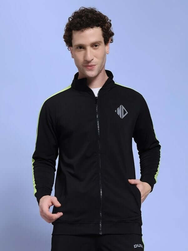 Man wearing HIGH PERFORMANCE JACKET IN BLACK for athletes and urban explorers, featuring weather-resistant polyester and sleek design.