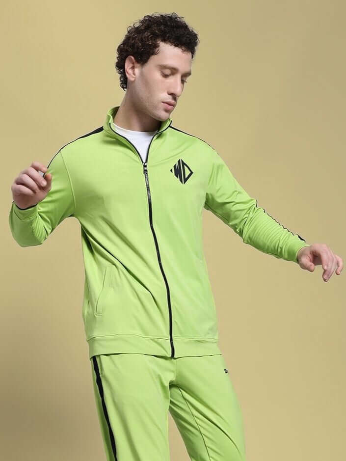 Person wearing HIGH PERFORMANCE JACKET NEON GREEN, designed for athletes with advanced weather-resistant polyester and sleek style.