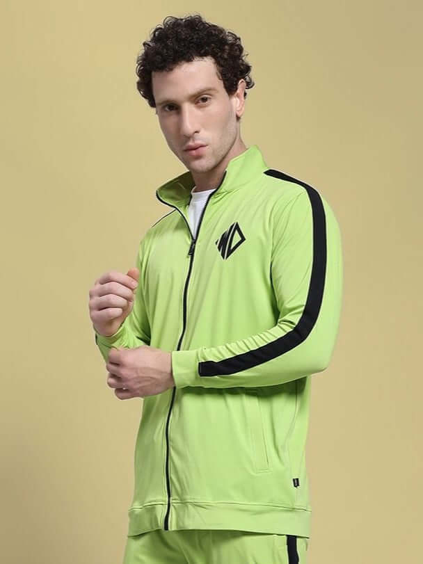 Man wearing HIGH PERFORMANCE JACKET NEON GREEN, designed for athletic and urban use, featuring advanced weather-resistant materials.