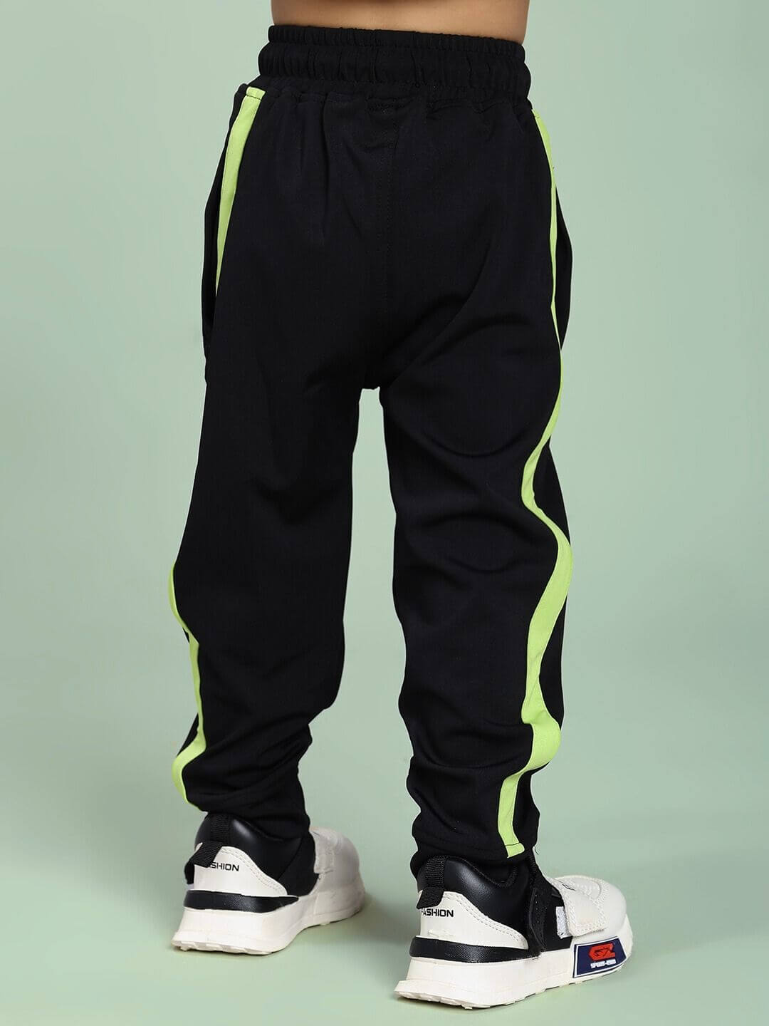 HIGH PERFORMANCE JOGGER FOR BOYS AND GIRLS BLACK with neon accents for active kids.