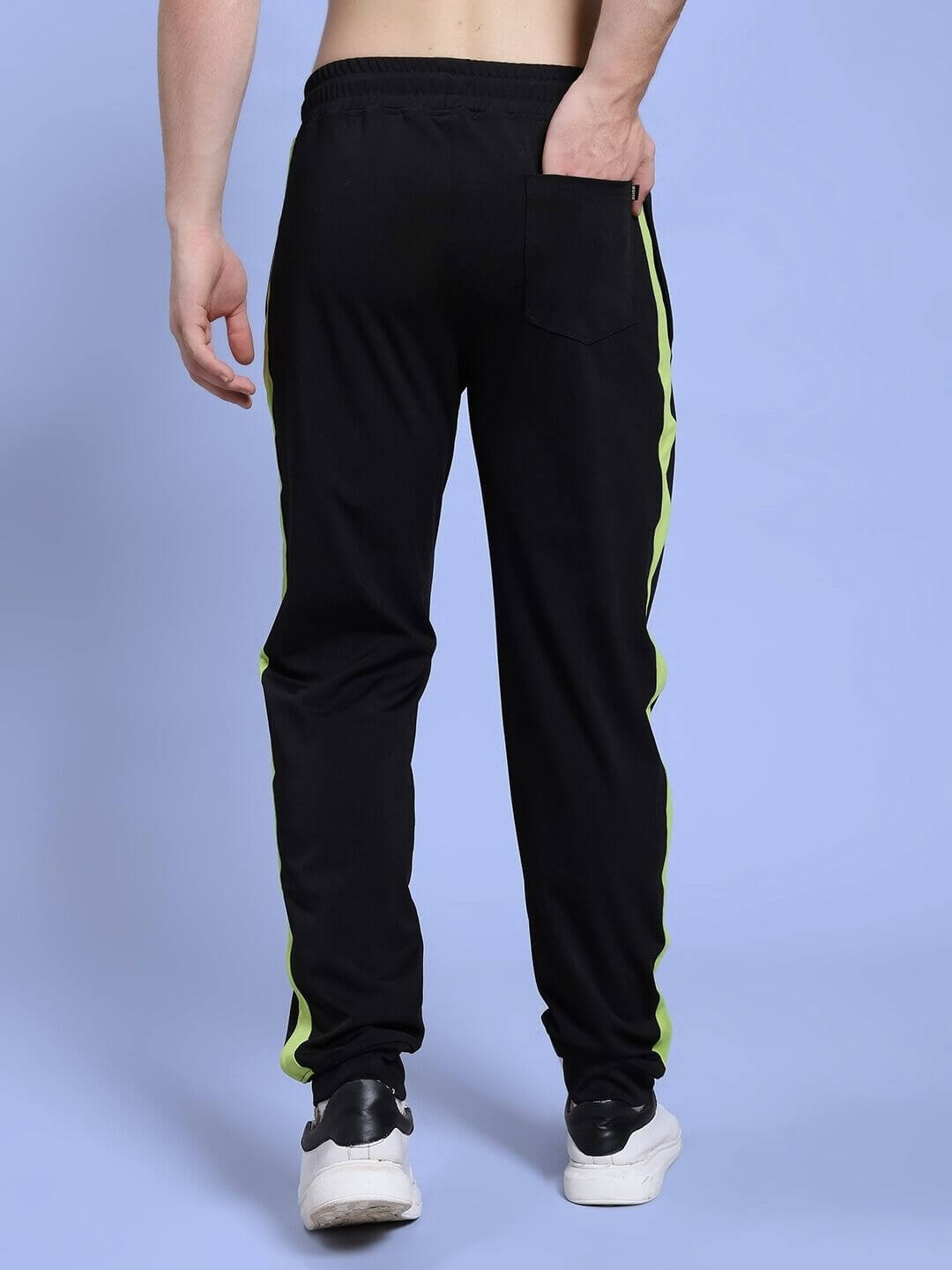 Back view of HIGH PERFORMANCE RELAXED FIT JOGGER BLACK with neon side stripes, featuring soft polyester and spandex blend.