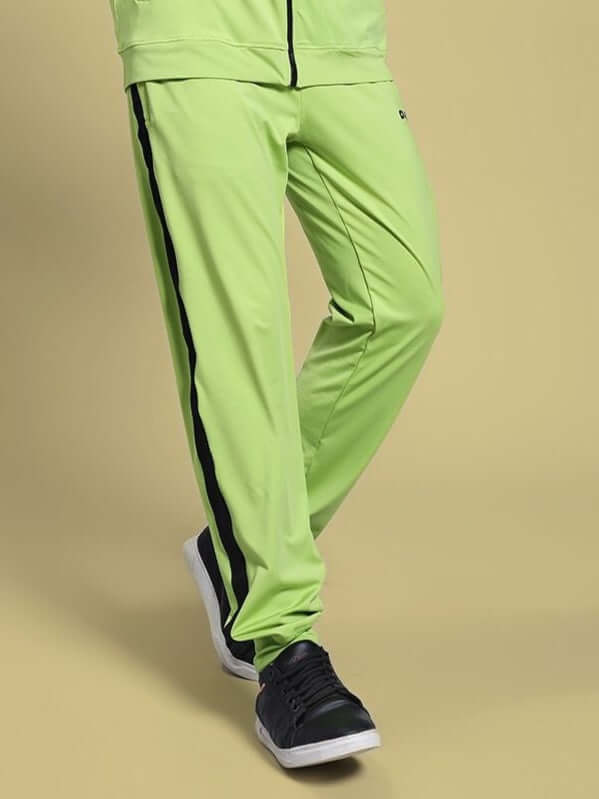 Person wearing HIGH PERFORMANCE RELAXED FIT JOGGER NEON GREEN with black stripe, showcasing comfort and style for active lifestyles.