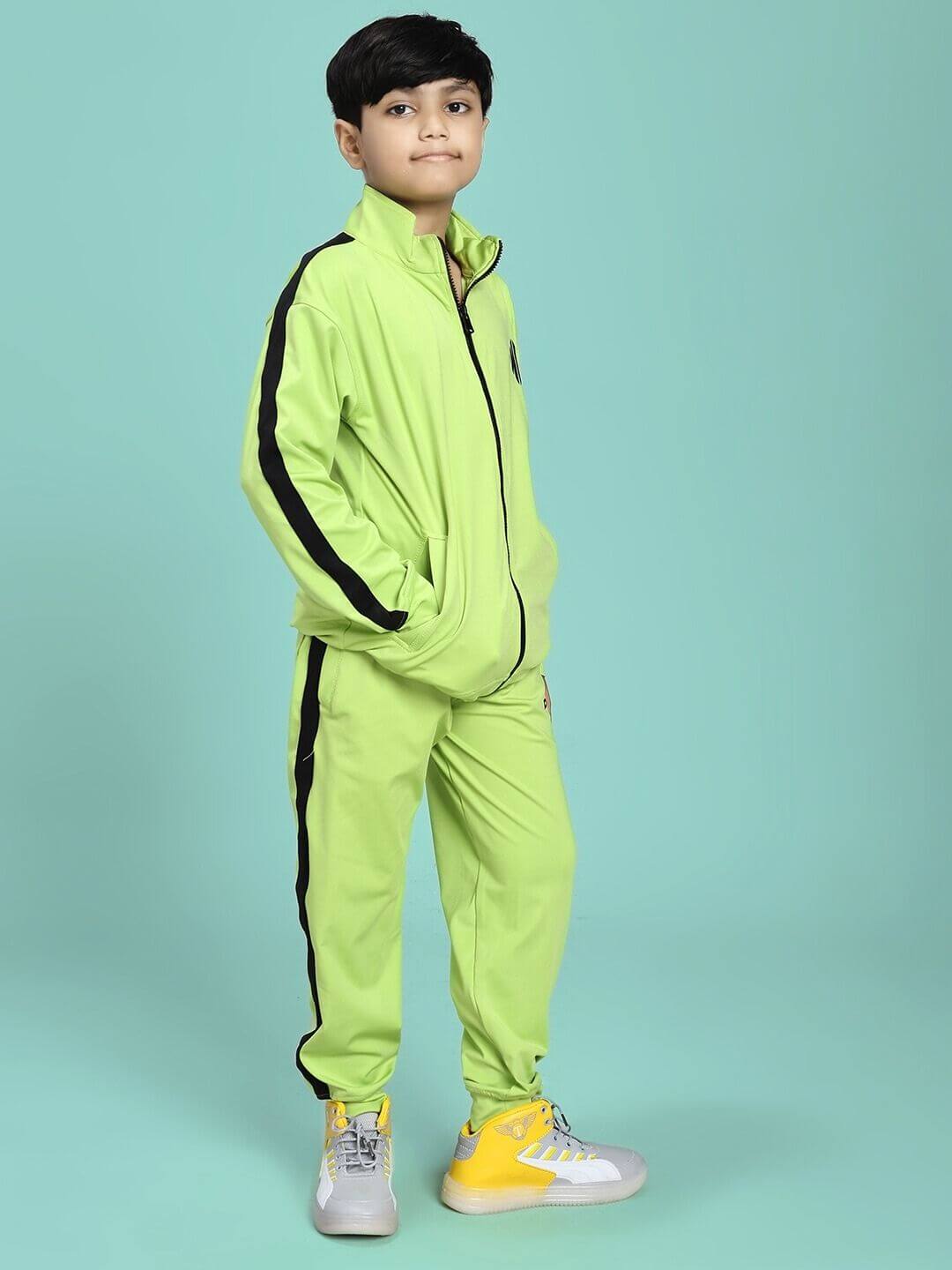 Boy wearing HIGH PERFORMANCE CO-ORD SET FOR BOYS AND GIRLS NEON GREEN, standing confidently showcasing the versatile unisex outfit.