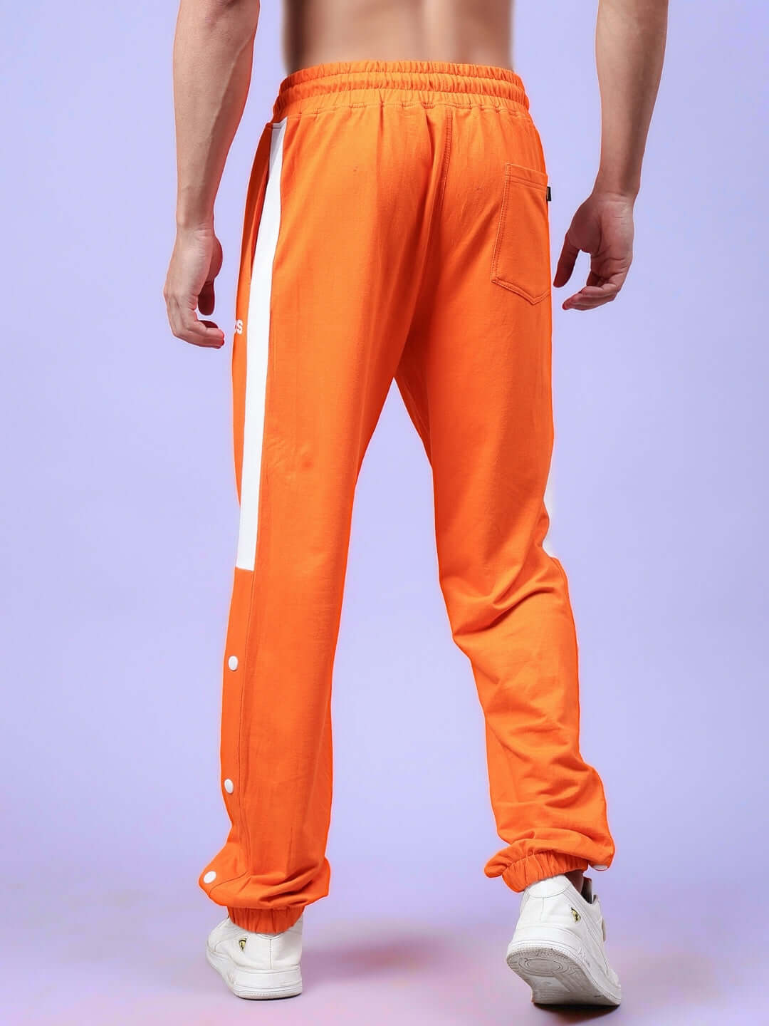 Back view of High Point Contrast Joggers in orange-white, showcasing custom fit options by DUDS.