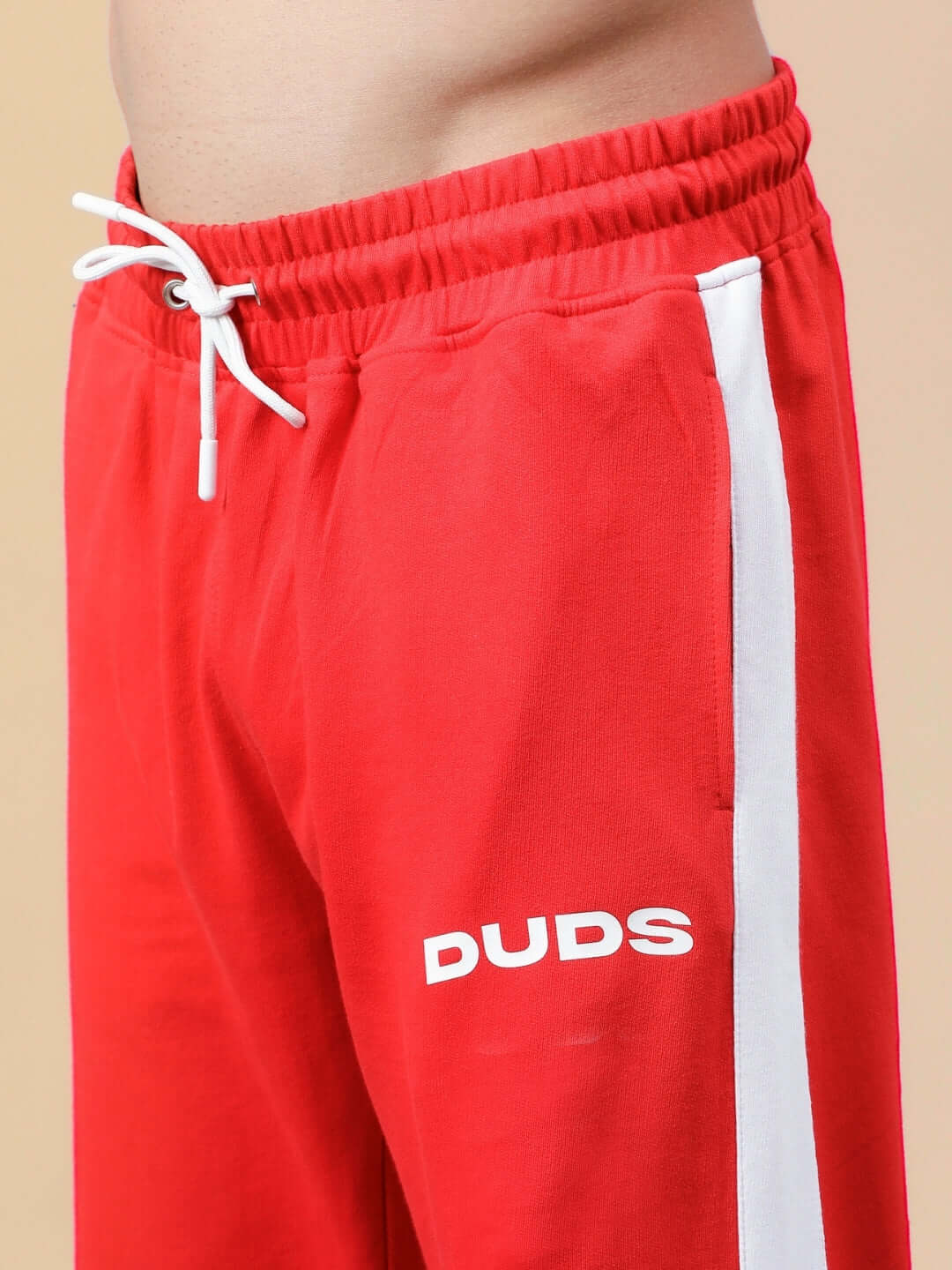 Red and white HIGH POINT CONTRAST JOGGERS by DUDS featuring drawstring waist, ideal for casual wear.
