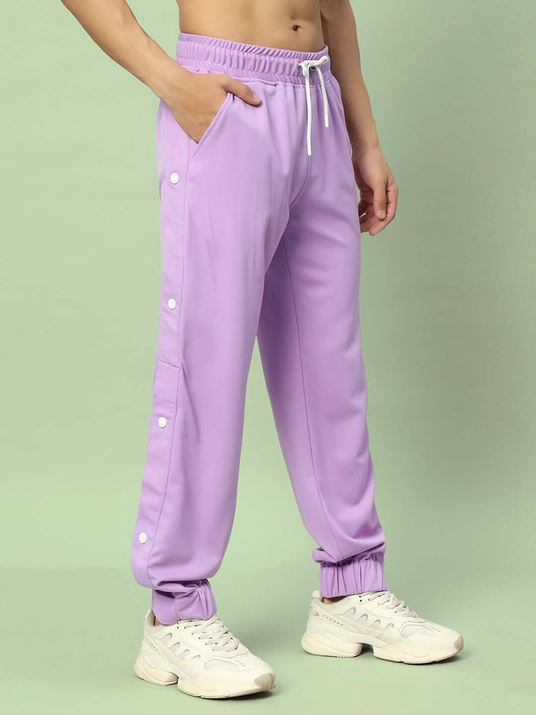 Lavender hip hop joggers with white buttons, elastic waistband, and comfortable fit, designed by DUDS.