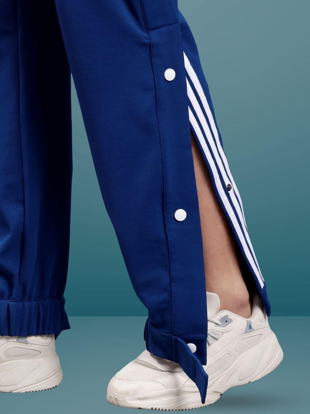 Marine Blue Hip Hop Joggers with side buttons and stripes, paired with white sneakers, showcasing casual and stylish fashion.