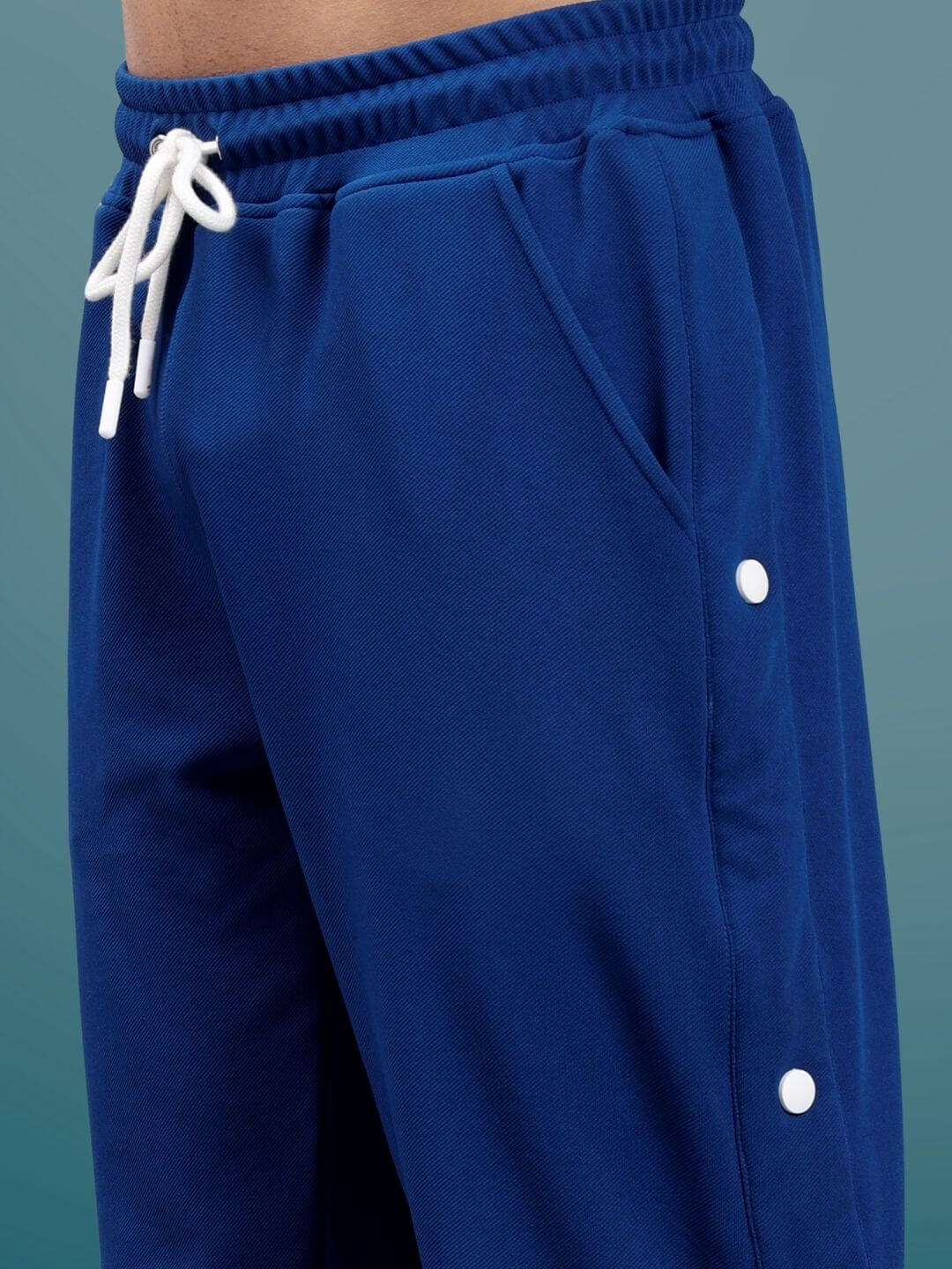 Marine blue hip hop joggers with white drawstring and button detail, made-to-order by DUDS Tailors. Custom fit available.