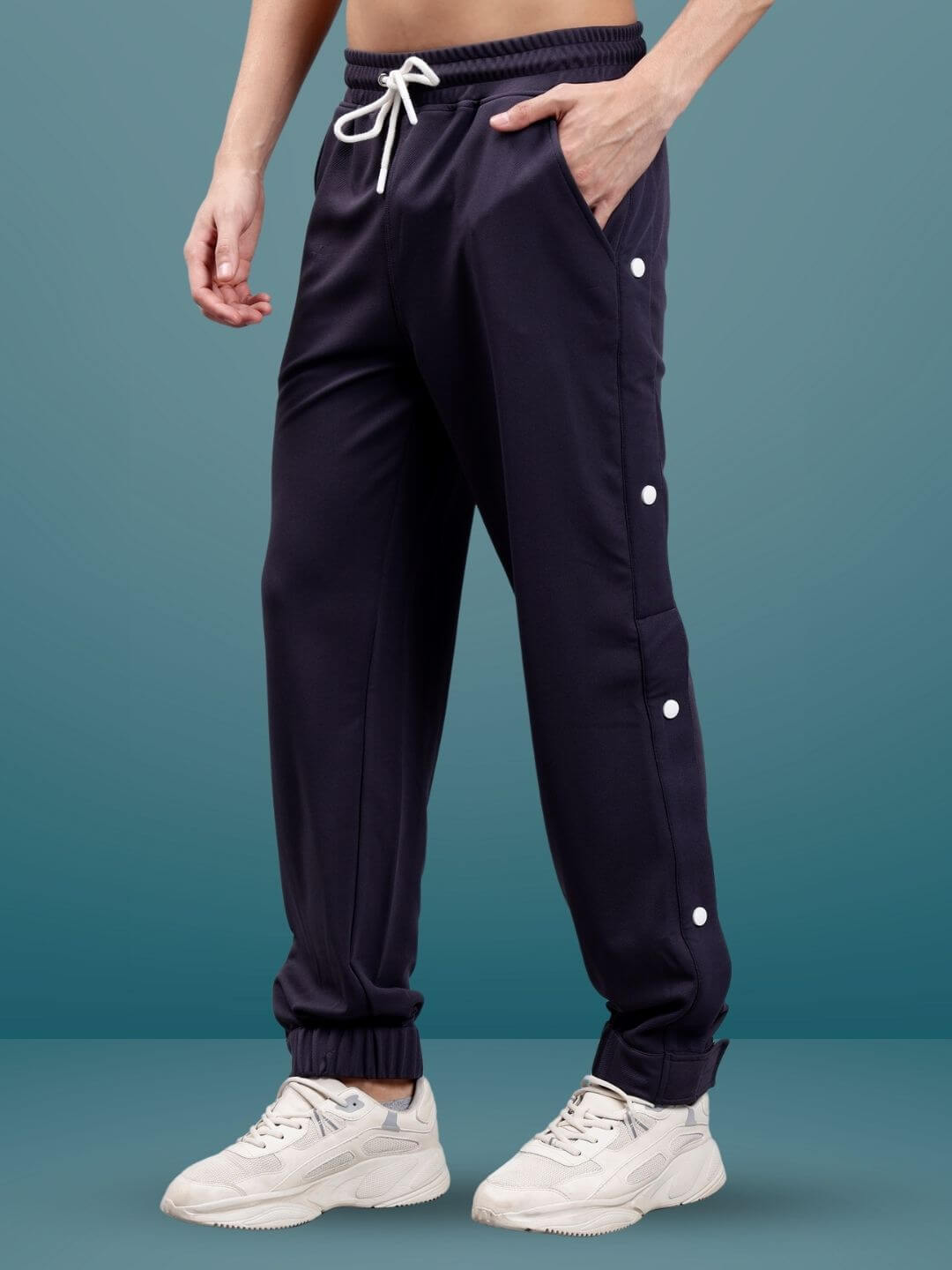 Dark steel grey hip hop joggers by DUDS with elastic waistband and side buttons, customizable fit option available.