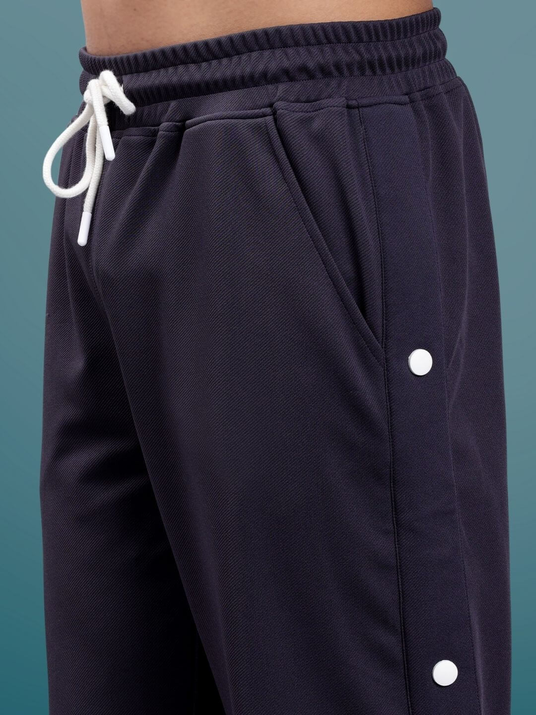 Dark steel grey hip hop joggers with white drawstring and button details, showcasing custom fit option by DUDS for a tailored look.