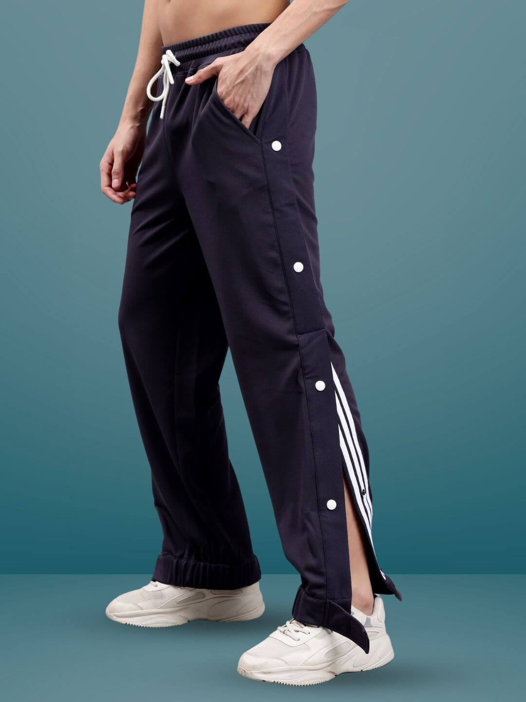 Model wearing dark steel grey hip hop joggers with side stripes, showcasing custom fit option for personalized style.