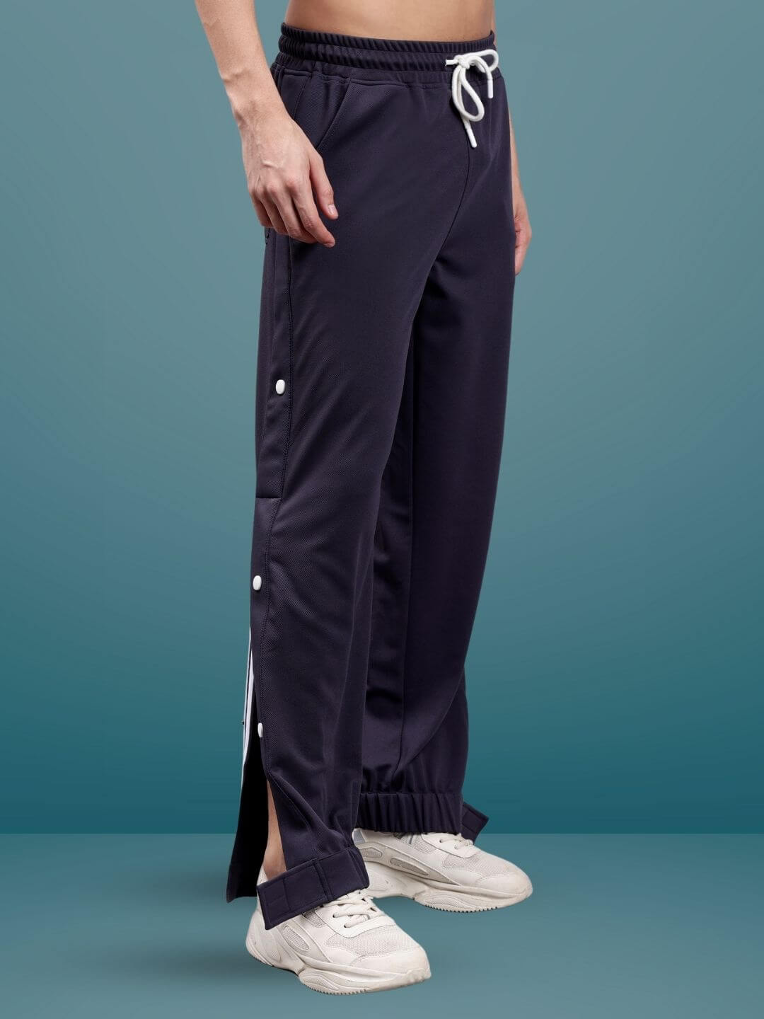 Dark steel grey hip hop joggers with button detail, showcasing a relaxed fit and custom size options by DUDS tailors.