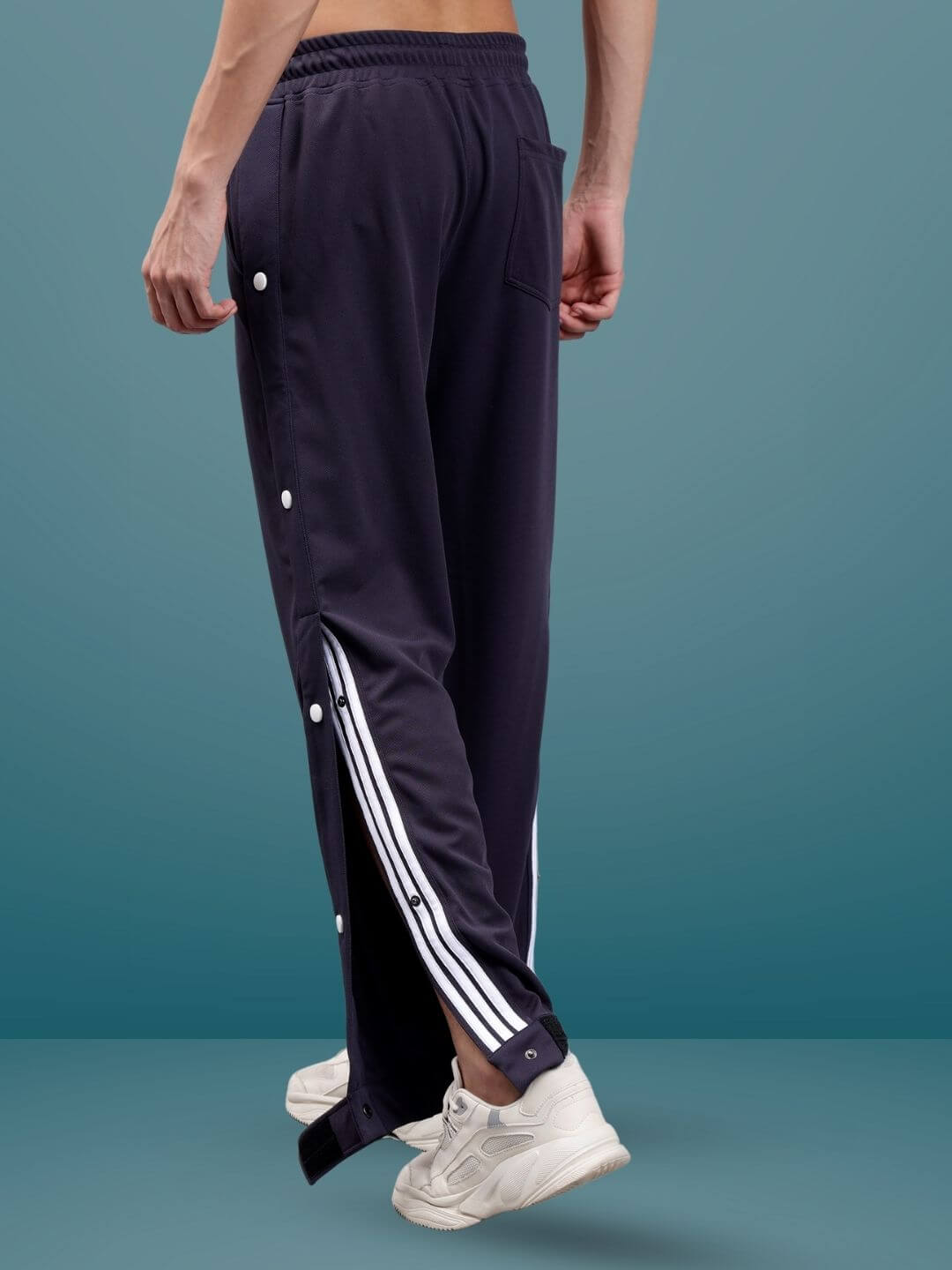 Man wearing dark steel grey hip hop joggers by DUDS with stripe detail, showcasing casual street style fashion.