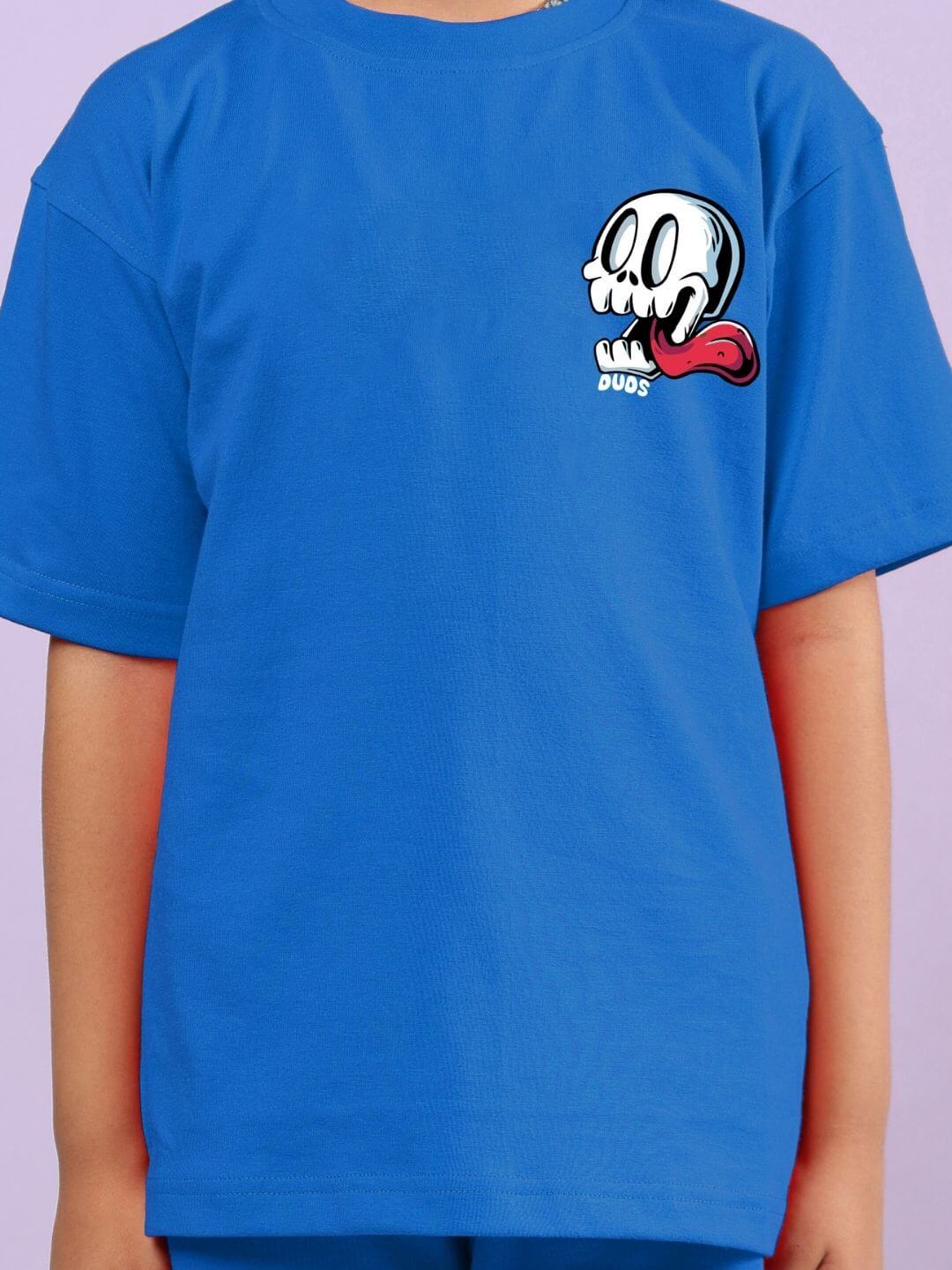 Child wearing Holiday Time Rider Print Co-ord for Boys and Girls Blue, featuring a vibrant skull design on a blue shirt.