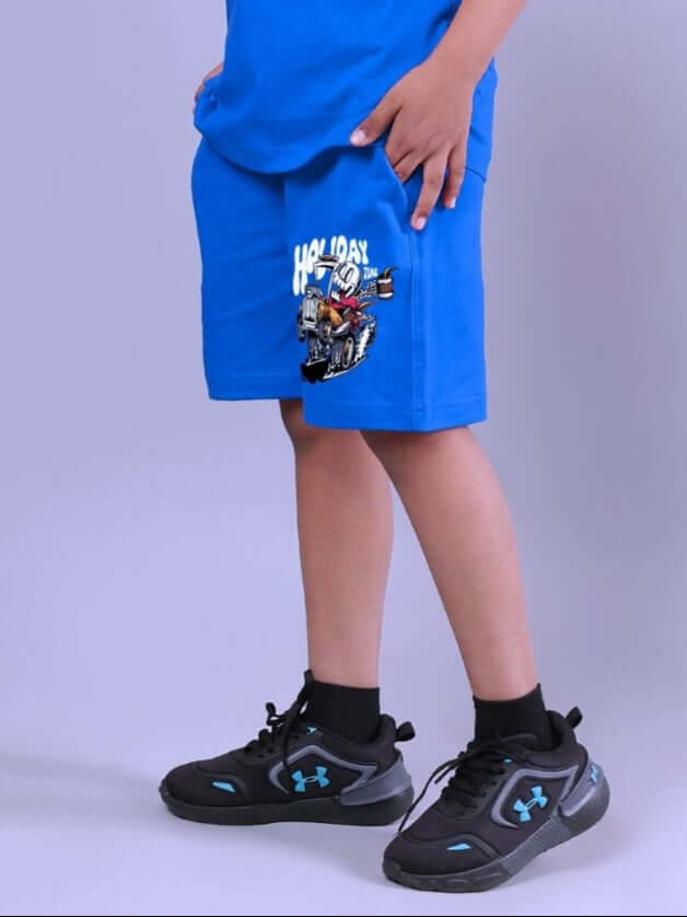 Child wearing blue Holiday Time Rider Print Shorts, showcasing comfortable fit and fun design for active play.