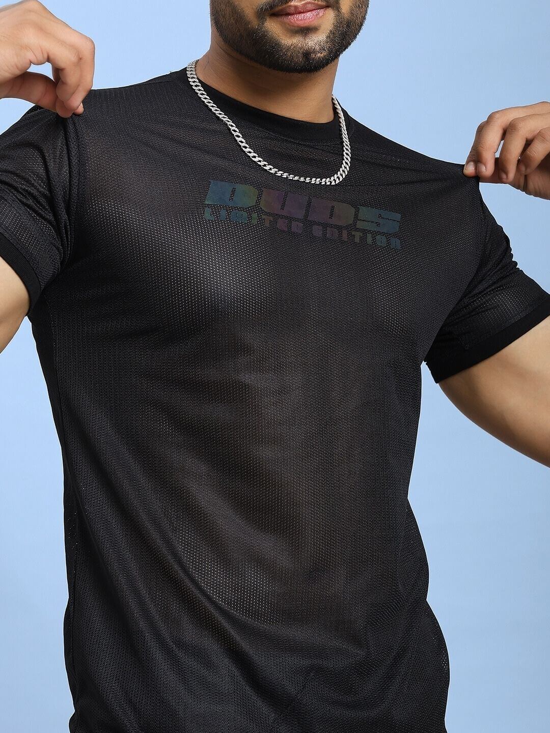 Man wearing HOLO BLACK MESH REGULAR FIT T-SHIRT BLACK with mesh panel design and chain necklace