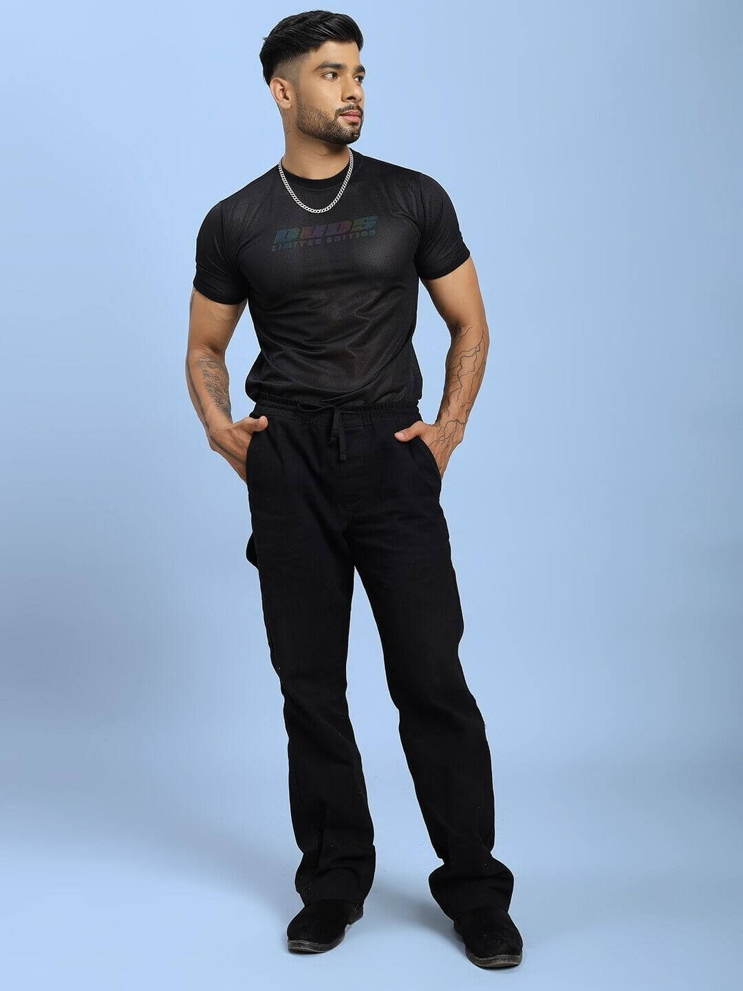 Model wearing HOLO BLACK MESH REGULAR FIT T-SHIRT BLACK with mesh panel design, showcasing modern and breathable style.