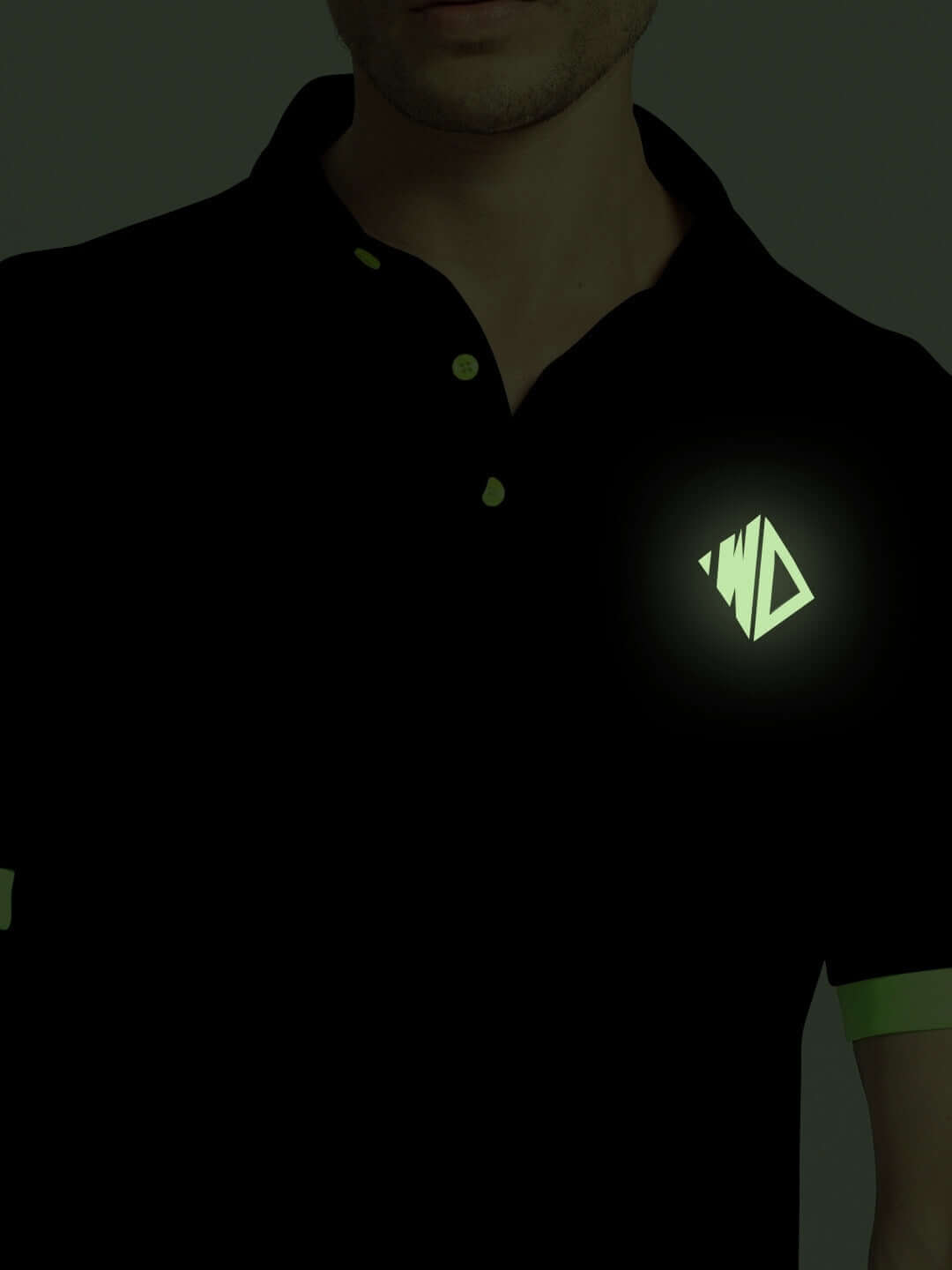 Person wearing HOOKUP REFLECTOR SUMMER CO-ORD SET BLACK with glowing logo in dark.
