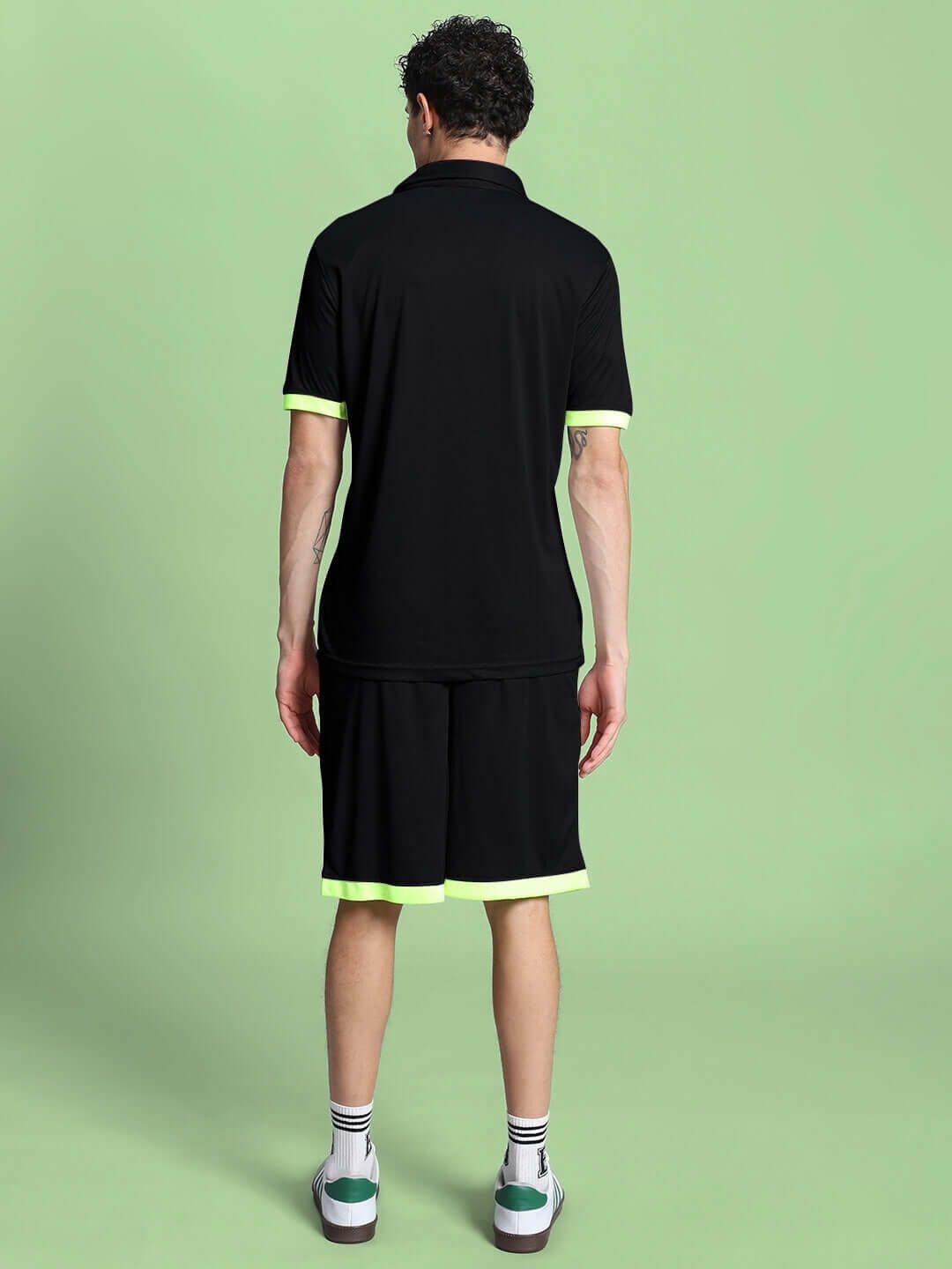 Back view of model wearing HOOKUP REFLECTOR SUMMER CO-ORD SET BLACK, stylish and breathable for warm-weather, unisex fashion.