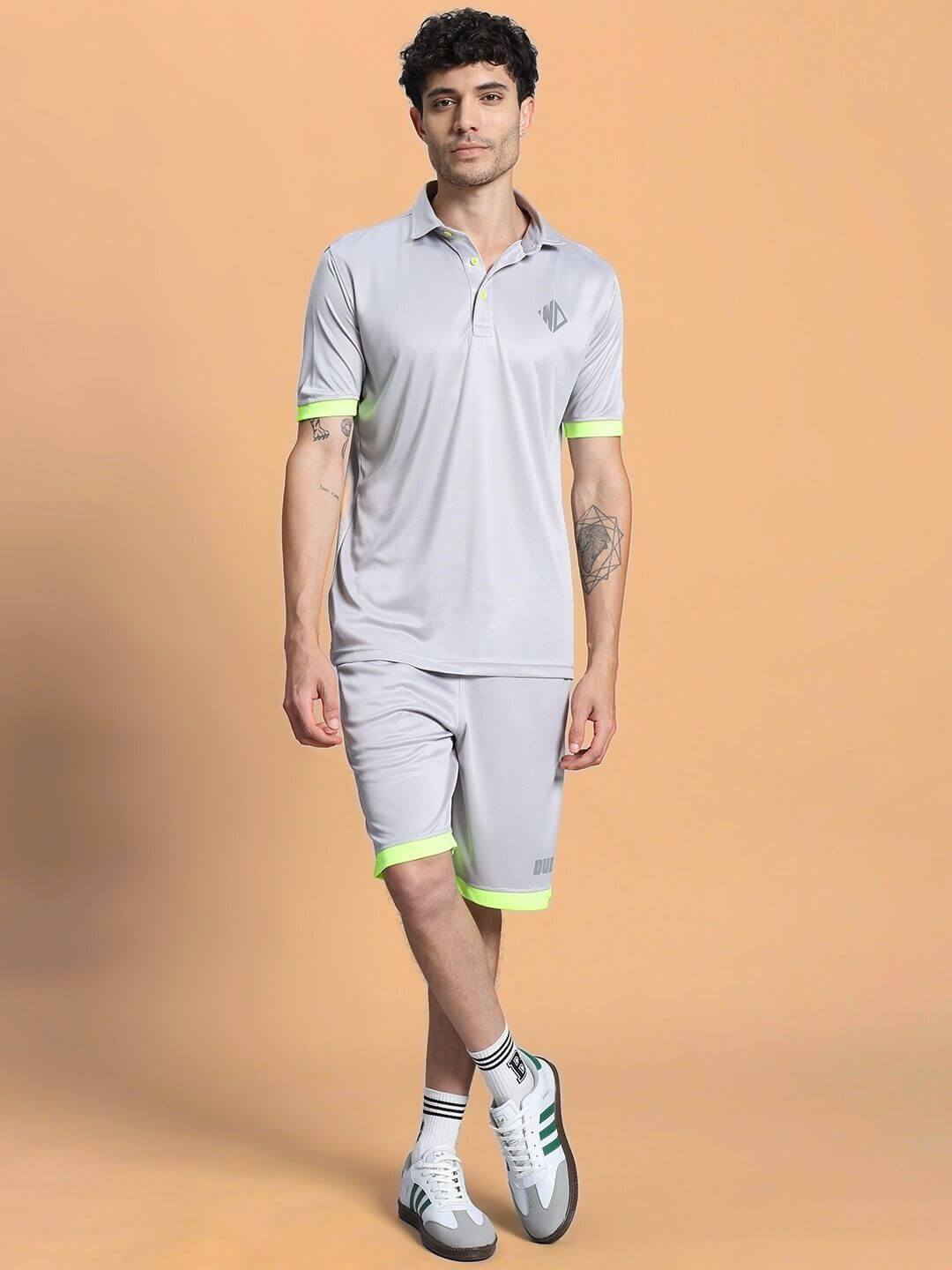Model wearing HOOKUP SUMMER POLYESTER CO-ORD SET GREY with sporty design and neon accents, perfect for summer fashion and workouts.